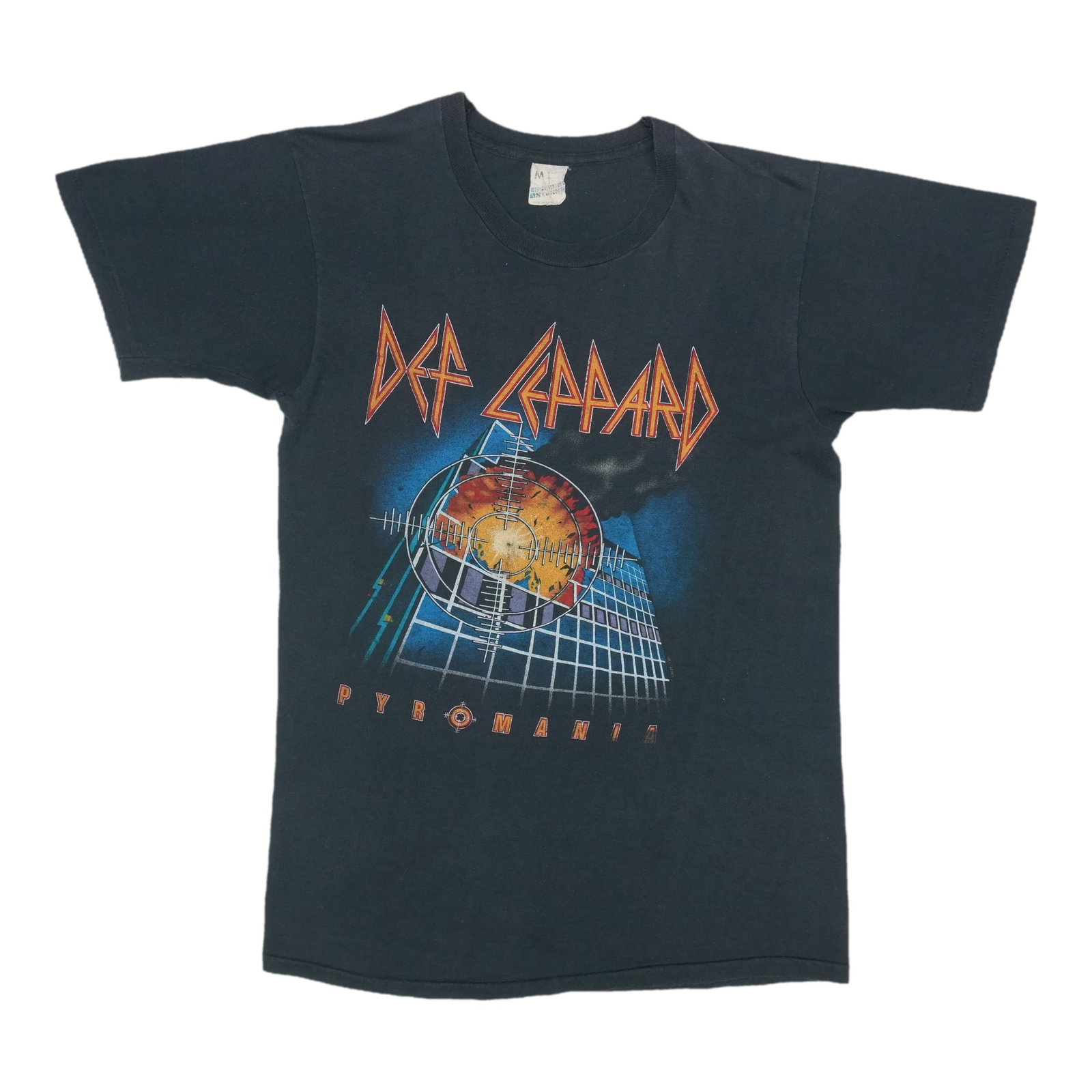 1983 Def Leppard Pyromania Shirt: 1983 Def Leppard Pyromania Shirt The 1983 Def Leppard Pyromania Shirt is a true vintage treasure, boasting front and back graphics that showcase the band's iconic style. Measuring 17" pit to pit front