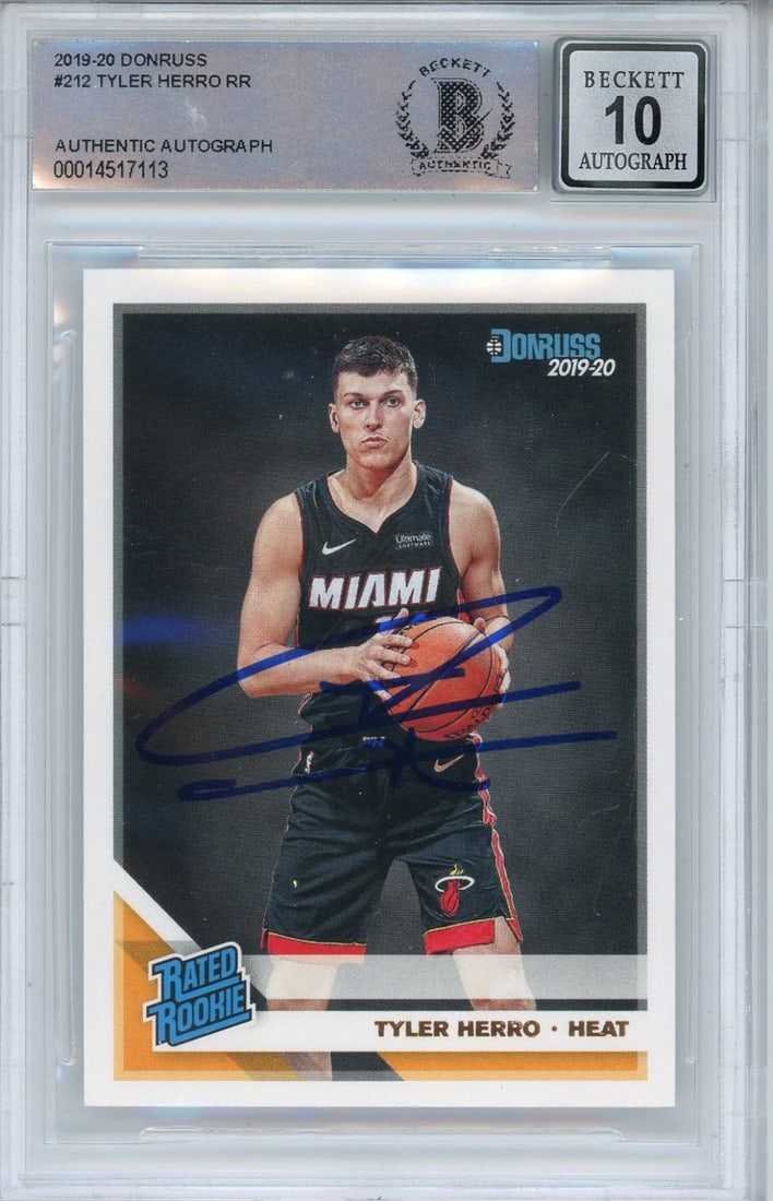 Tyler Herro Autographed 2019-20 Panini Donruss Rookie Card #212 (BGS 10 Auto): Tyler Herro Autographed 2019-20 Panini Donruss Rookie Card #212 (BGS 10 Auto) Signed in blue sharpie across the front, Tyler Herro's rookie card #212 from the 2019-20 Panini Donruss set boasts an impr