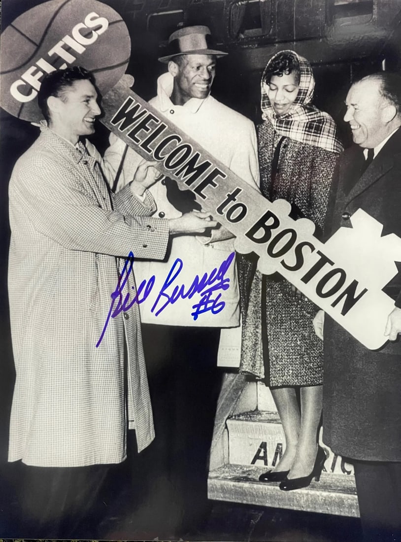 Basketball photo autographed by Bill Russell: Basketball photo autographed by Bill Russell Signed across the front in blue sharpie, this 8x10 basketball photo features a notable signature from Bill Russell. The item bears a clear and visible mark
