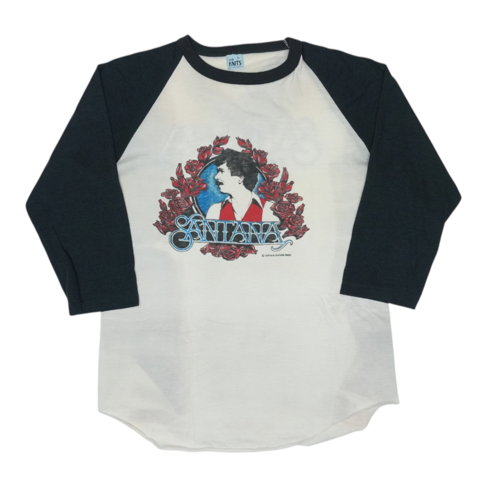 Santana Tour Jersey Shirt: Santana Tour Jersey Shirt Large, white Santana Tour Jersey Shirt with front and back graphics. This vintage 1980 tour tee features a classic design and 19-inch pit-to-pit length, making it a great add