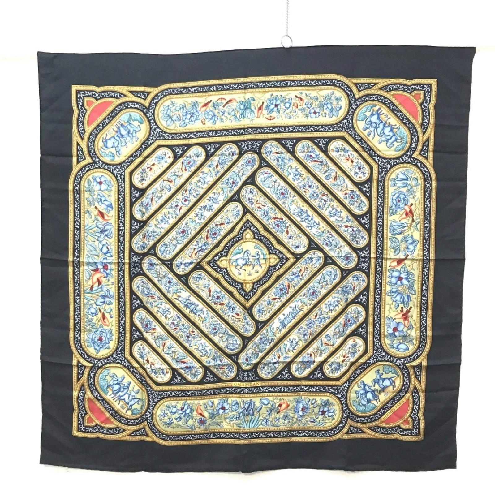 Silk by Hermes: Silk by Hermes Silk by Hermes, a stunning black silk scarf measuring 85cm x 88cm. This elegant accessory features high-quality silk material and bears the signature of the renowned brand. A timeless a