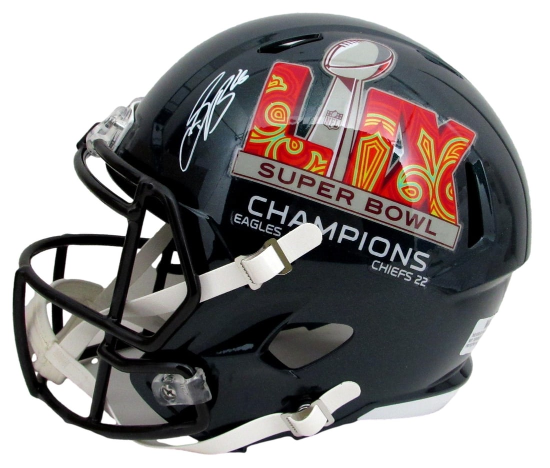 Signed Saquon Barkley Full Size Eagles Replica Helmet SB LIX Logo: Signed Saquon Barkley Full Size Eagles Replica Helmet SB LIX Logo Signed by Saquon Barkley, this full-size replica helmet features the iconic SB LIX logo, making it a unique addition to any Philadelph