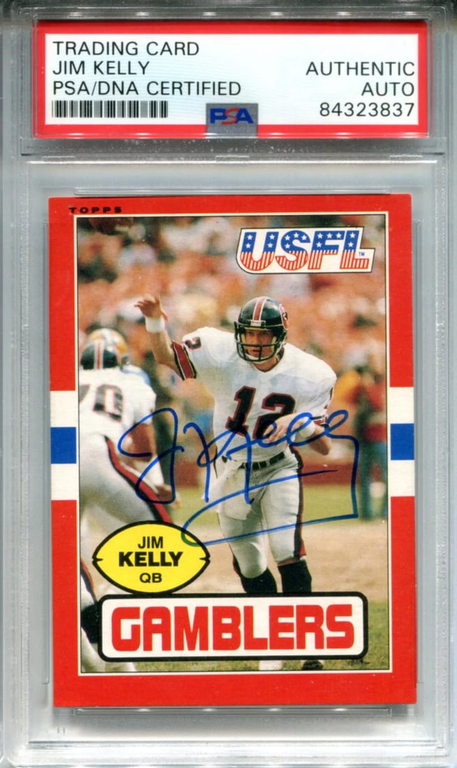 Jim Kelly Autographed 1985 Topps USFL Card (PSA): Jim Kelly Autographed 1985 Topps USFL Card (PSA) Signed in blue sharpie across the front, Jim Kelly's autograph adds authenticity to this 1985 Topps USFL card. Provided with PSA authentication and sla