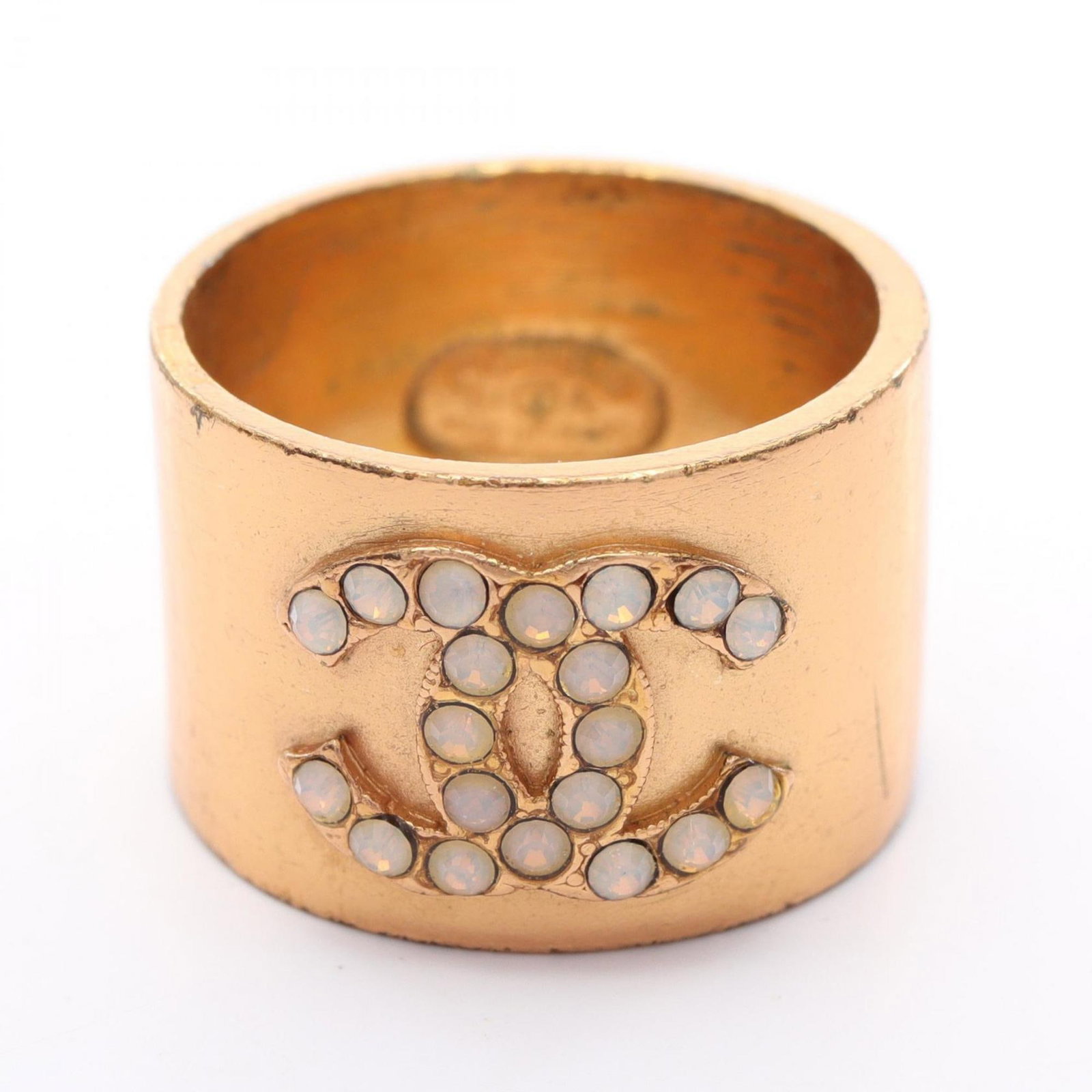 Chanel Band Ring Gold Plating: Chanel Band Ring Gold Plating Gold plating adds a touch of luxury to this sleek band ring from Chanel, a timeless design for women's fashion. Made from gold plating, the ring features a classic style 
