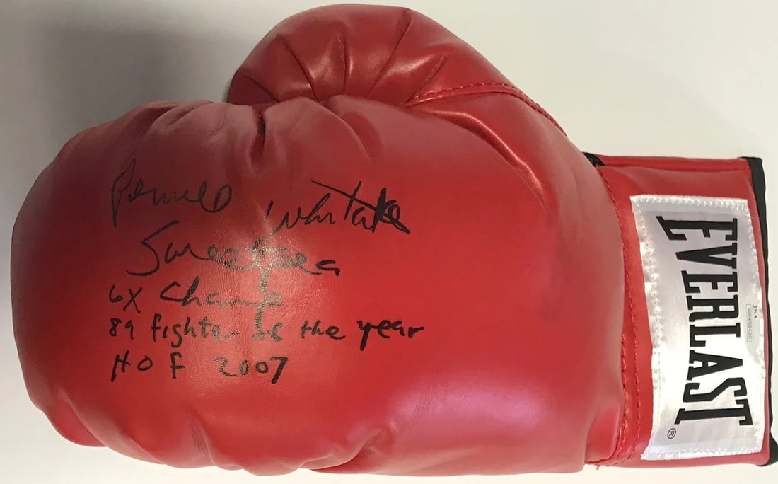 Pernell Whitaker Autographed Red Everlast Left Boxing Glove (JSA): Pernell Whitaker Autographed Red Everlast Left Boxing Glove (JSA) Signed by Pernell Whitaker in black sharpie, this Everlast boxing glove bears the inscription "Sweet Pea, 6x Champ, 89 Fighter of the 