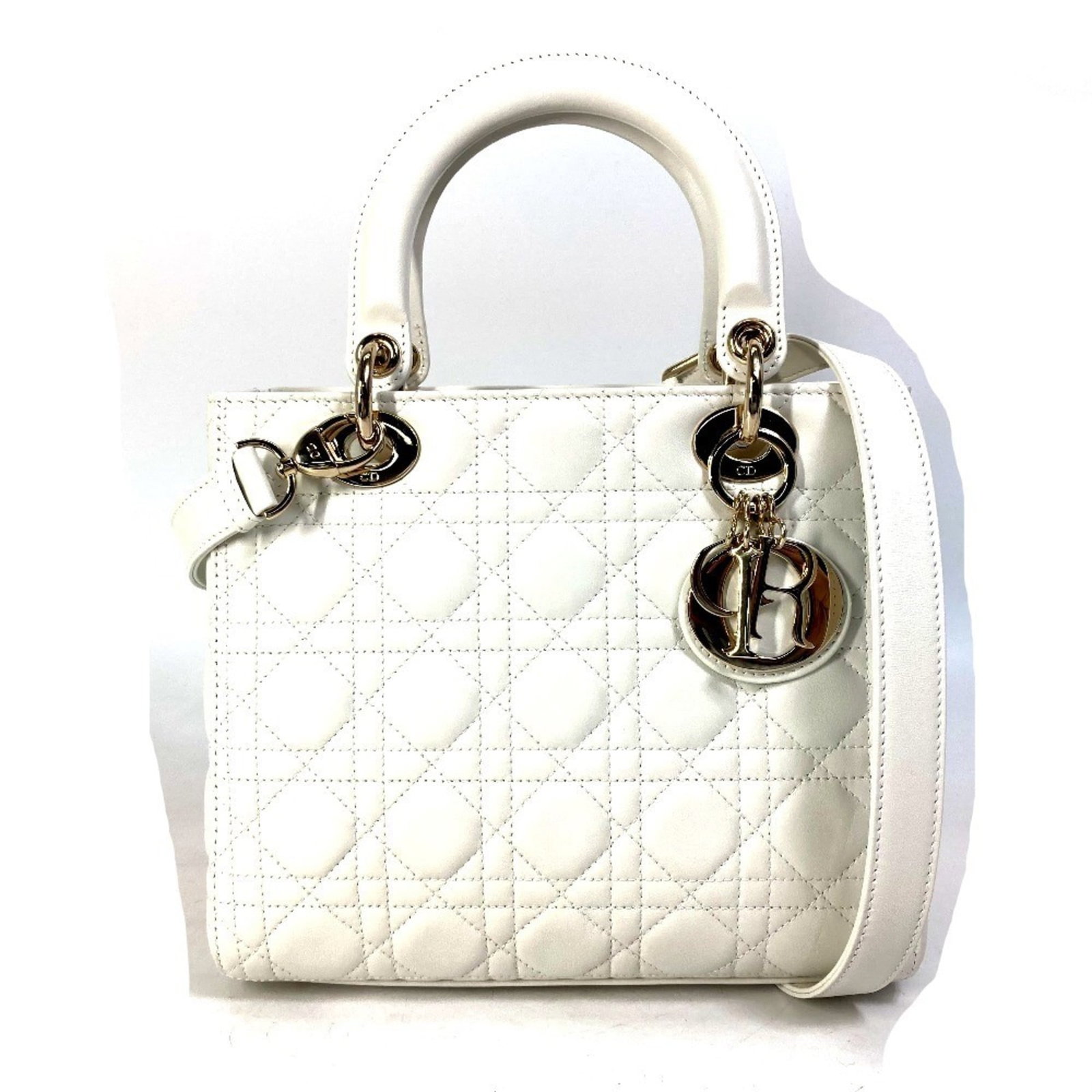 Shoulder bag of leather by Christian Dior: Shoulder bag of leather by Christian Dior White lambskin shoulder bag from Christian Dior, measuring 20cm x 24cm x 11cm. Comes with box, dust bag, and guarantee card. A classic design from the renowne