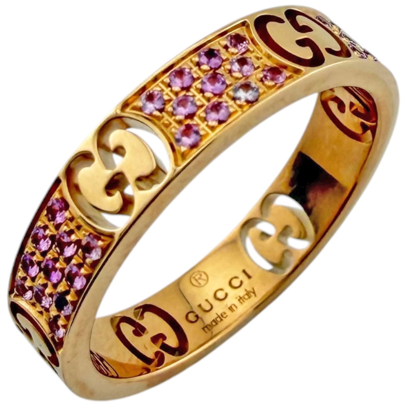 Pink Gold 18k Gucci Ring Band: Pink Gold 18k Gucci Ring Band Pink gold (18K) Gucci ring band with a beautiful pink sapphire stone, showcasing the brand's signature style. Handmade with attention to detail, this 18k pink gold band