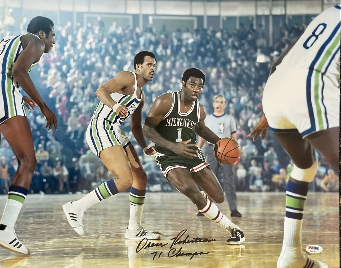 Oscar Robertson Autographed 16x20 Basketball Photo (PSA): Oscar Robertson Autographed 16x20 Basketball Photo (PSA) Signed in black sharpie across the front of the photo with inscription "71 Champs" by NBA legend Oscar Robertson, this 16x20 basketball photo b