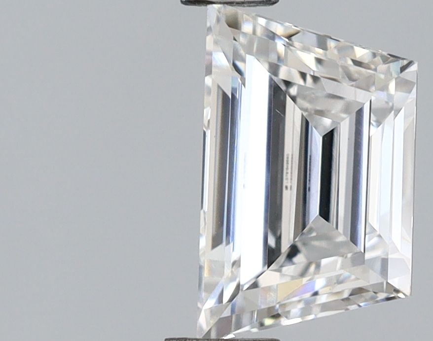 IGI Trapezoid 0.56ct E VVS2 - Loose Lab Diamond: IGI Trapezoid 0.56ct E VVS2 - Loose Lab Diamond Item Specifics: Source: This Is A Real Diamond Grown In A Lab Not Mined. Carat: 0.56 Cut: - Color: E Clarity: VVS2 Polish: VG Symmetry: VG Measurements: