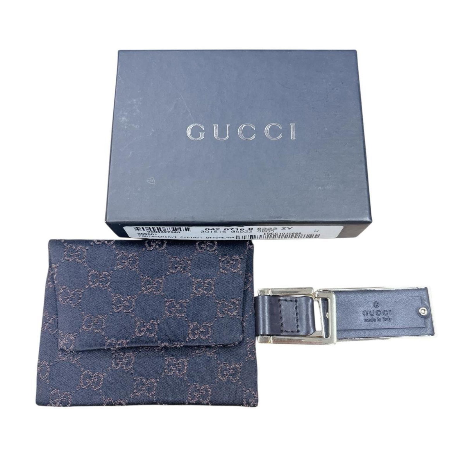 Keyring Leather Gucci: Keyring Leather Gucci This Gucci leather keyring boasts a classic brown color and sleek design, showcasing the brand's signature style. Made from high-quality leather, it measures 11.5cm x 2.3cm x