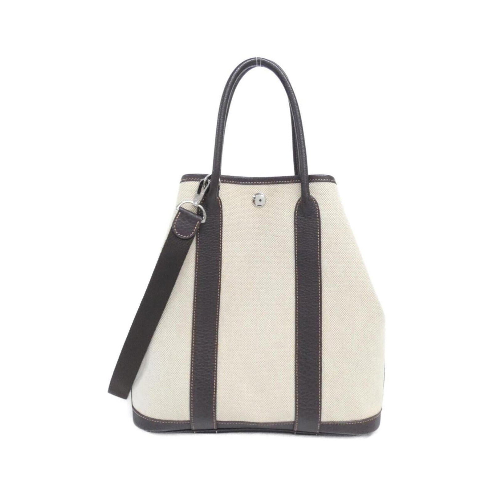 Handbag Toile By Hermes: Handbag Toile By Hermes Toile de Jouy, a classic design by Herm?s, adorns this beautifully crafted handbag in rich brown hues. The timeless elegance and sophistication of the silver-toned hardware add