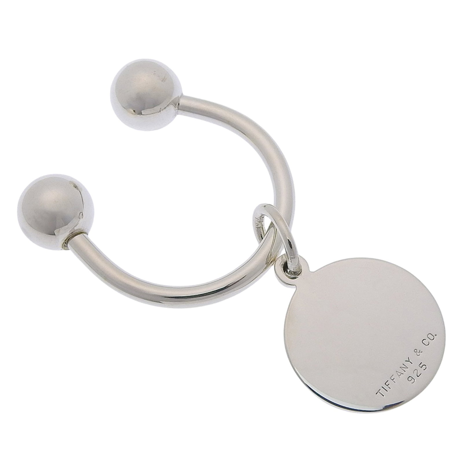 Tiffany silver keyring 925: Tiffany silver keyring 925 Tiffany silver keyring 925 features a beautifully crafted design made from high-quality silver material. The item measures 2.3cm x 1.9cm and boasts a sleek, compact size.