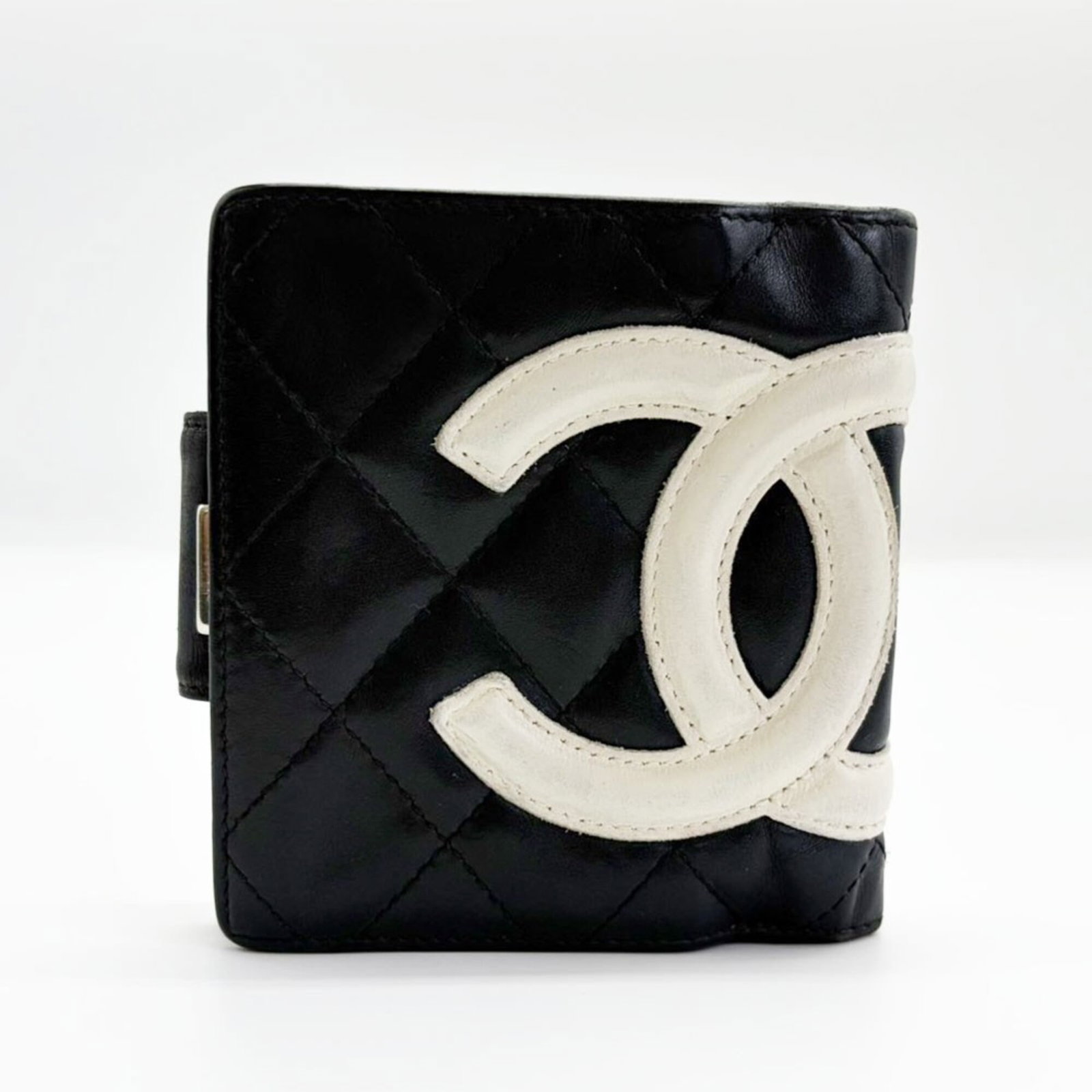 Chanel Wallet (Bi-Fold) Cambon Ligne: Chanel Wallet (Bi-Fold) Cambon Ligne This Chanel bi-fold wallet features the iconic Cambon ligne material, adding a touch of sophistication to its sleek design. With clean lines and a classic black