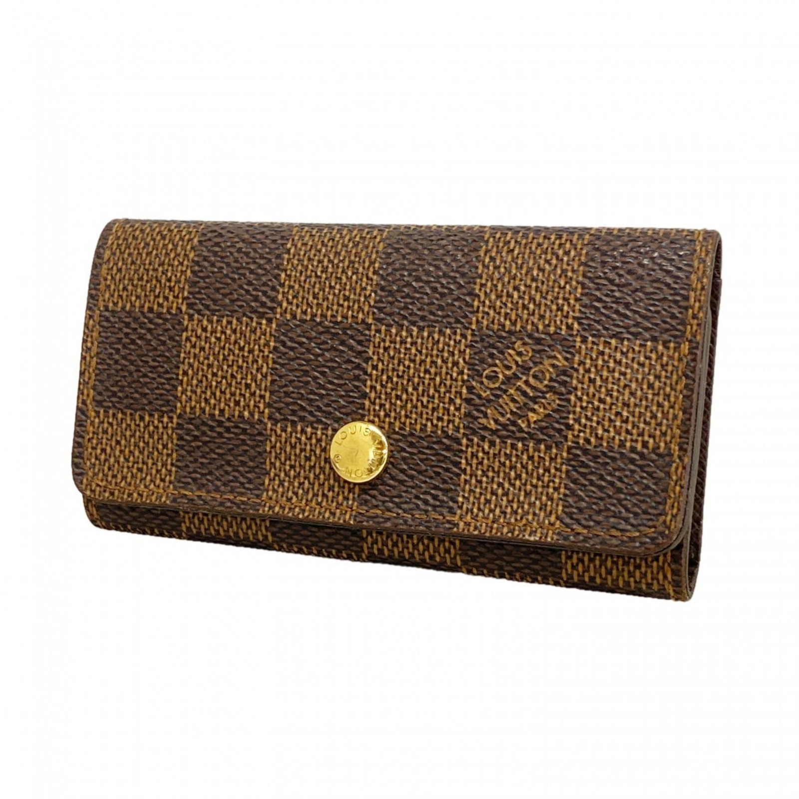 Keycase by Louis Vuitton: Keycase by Louis Vuitton Ebene-colored Keycase by Louis Vuitton, measuring 6cm x 10cm x 1.5cm, offers a sleek and compact storage solution for keys. Its rectangular shape and subtle color make it a ve