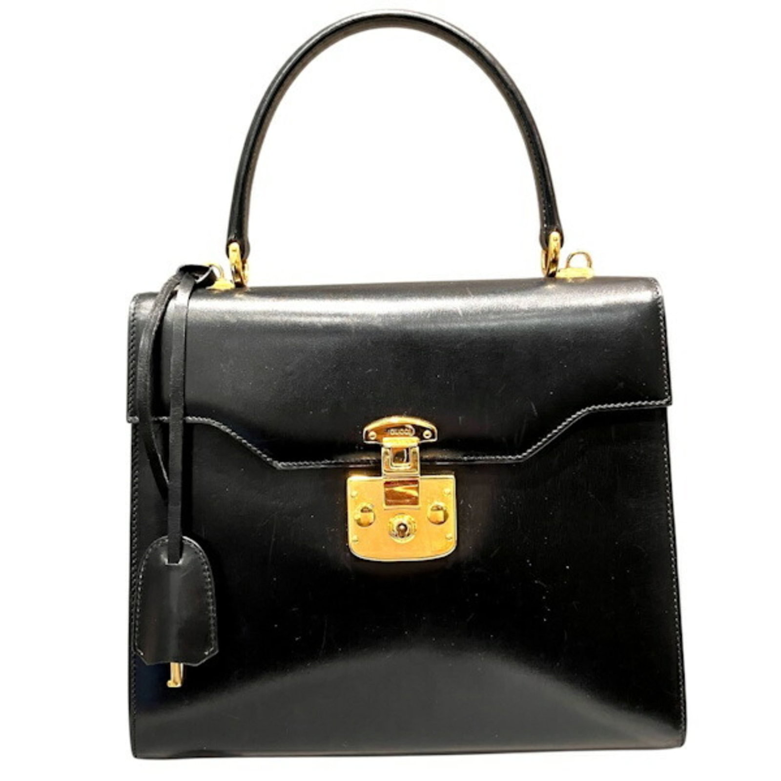 Gucci leather handbag: Gucci leather handbag The Gucci leather handbag boasts sleek black leather construction, measuring 20cm x 24cm x 9cm. This stylish accessory features a classic design with clean lines and a timeless