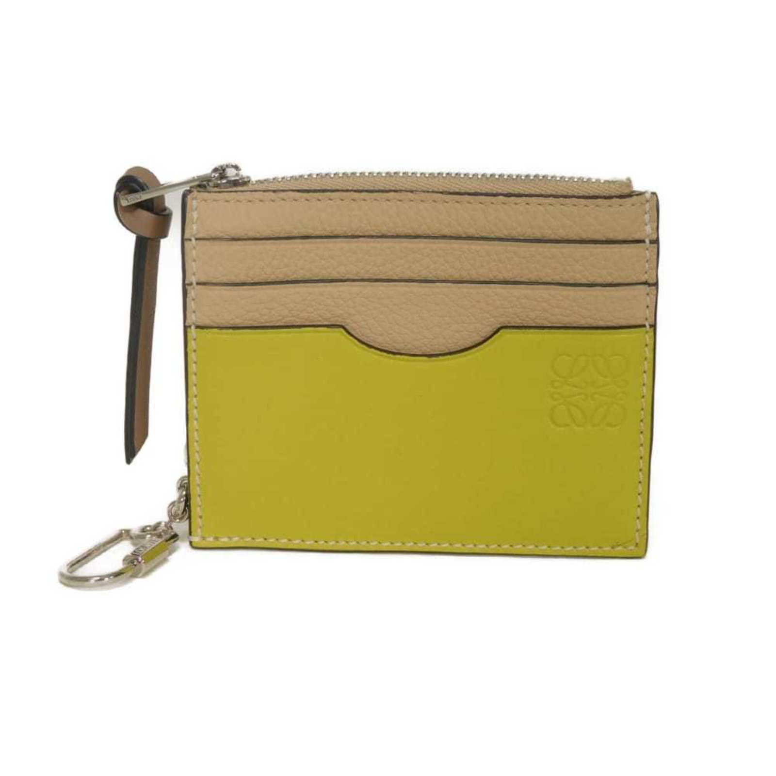Coin Case Leather Purse Loewe: Coin Case Leather Purse Loewe Nude beige leather coin case purse from Loewe, measuring 8.5cm x 10.5cm x 2cm in size. This small, elegant purse features a classic design and is made from high-quality