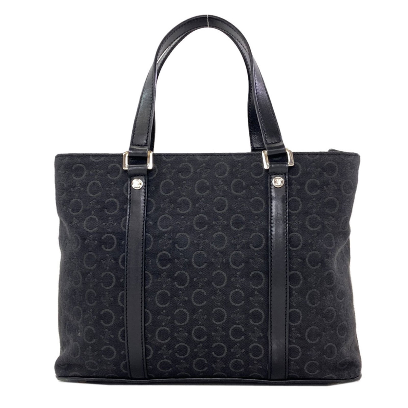 Canvas tote bag by Celine: Canvas tote bag by Celine Canvas tote bag by Celine, featuring black canvas material and a compact size of 20cm x 26cm x 10cm. This stylish tote bag boasts a sleek design that makes it perfect for eve