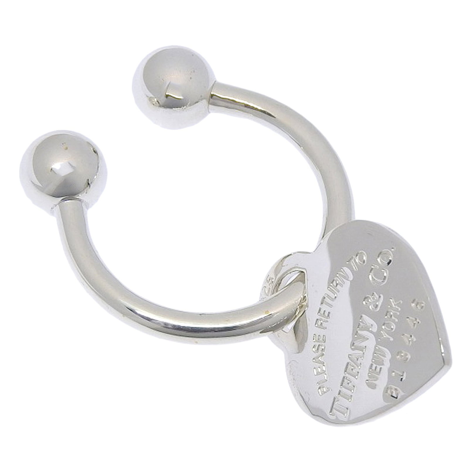 Tiffany silver keyring 925: Tiffany silver keyring 925 Tiffany silver keyring, crafted from high-quality 925 sterling silver, boasts a sleek and modern design. Measuring 3.1cm x 3.1cm in size, it makes for a stylish accessory to