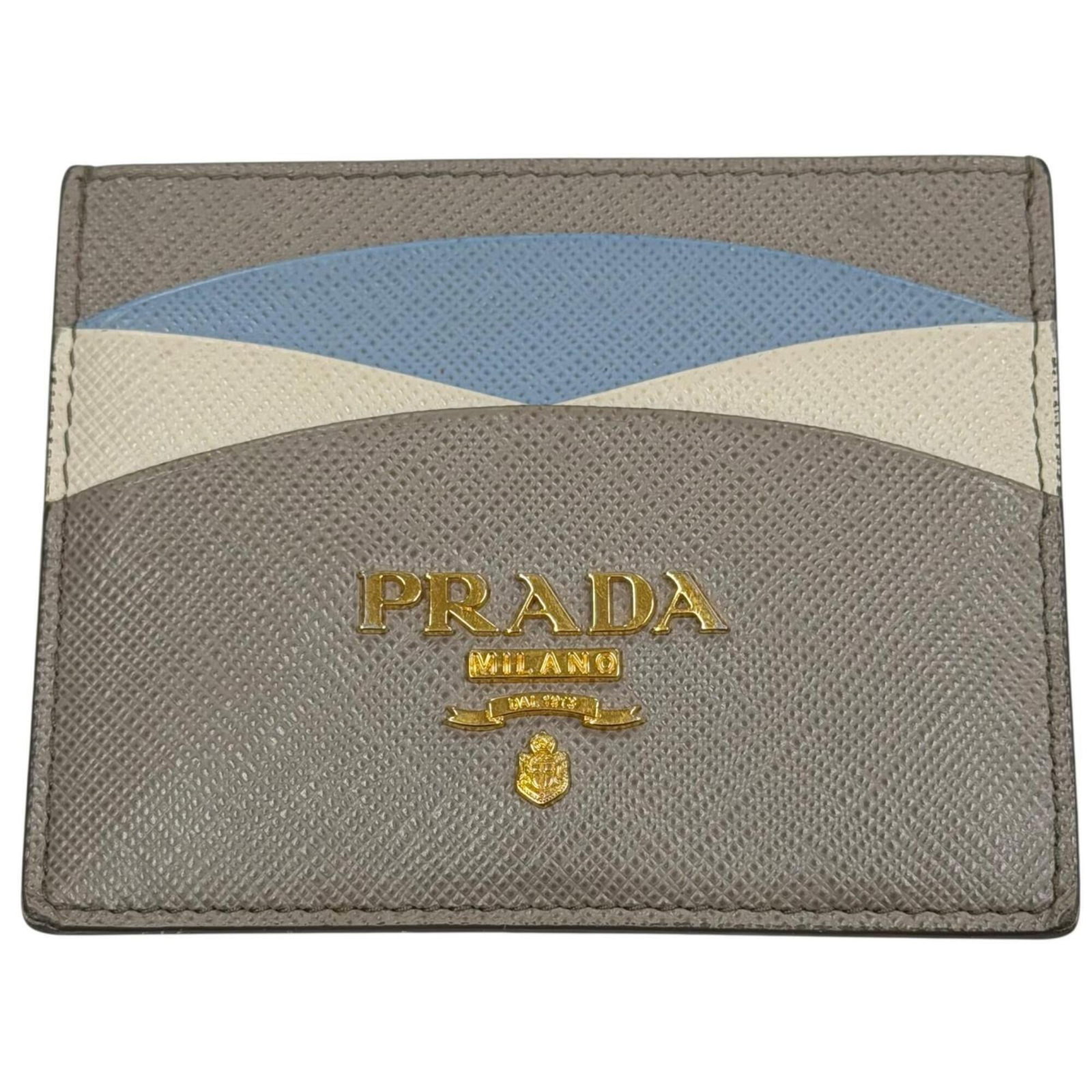 Card case leather by Prada: Card case leather by Prada Saffiano leather card case from Prada, Italy. Made with high-quality material, this compact case measures 8cm x 10cm / 3.14'' x 3.93''. A stylish accessory for everyday