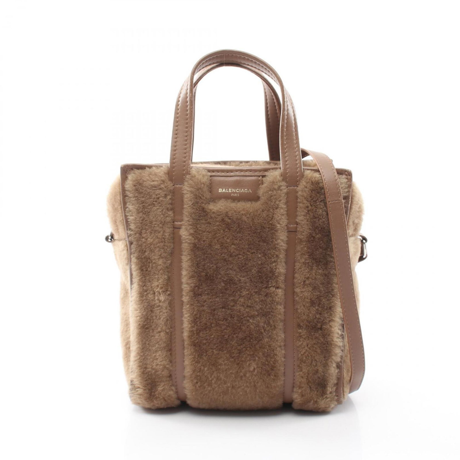 Handbag tote bag leather bag: Handbag tote bag leather bag Brown Mouton Leather Balenciaga Tote Bag with Signature. This brown leather tote bag from Balenciaga features the iconic mouton pattern, a classic design element of the