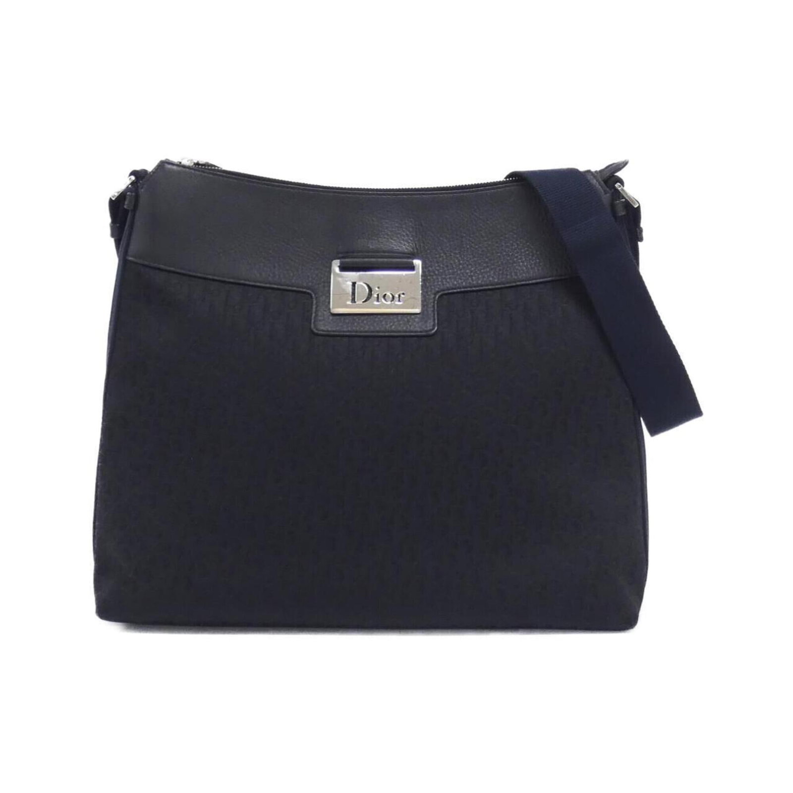 Shoulder Bag by Christian Dior: Shoulder Bag by Christian Dior Black Canvas Shoulder Bag by Christian Dior, measuring 30cm x 34cm x 9.5cm. This shoulder bag features a classic design with clean lines and a timeless aesthetic. Made