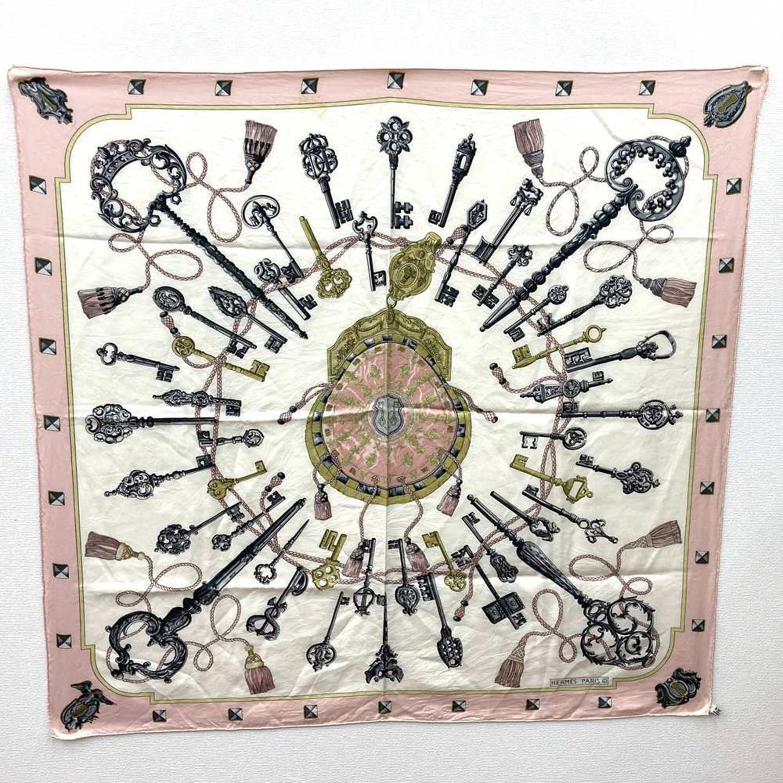 Hermes Silk Scarf: Hermes Silk Scarf Silk fabric, pink in color, and measuring 86cm x 85cm. This Hermes silk scarf features high-quality materials and a classic size. A signed piece from the renowned French fashion