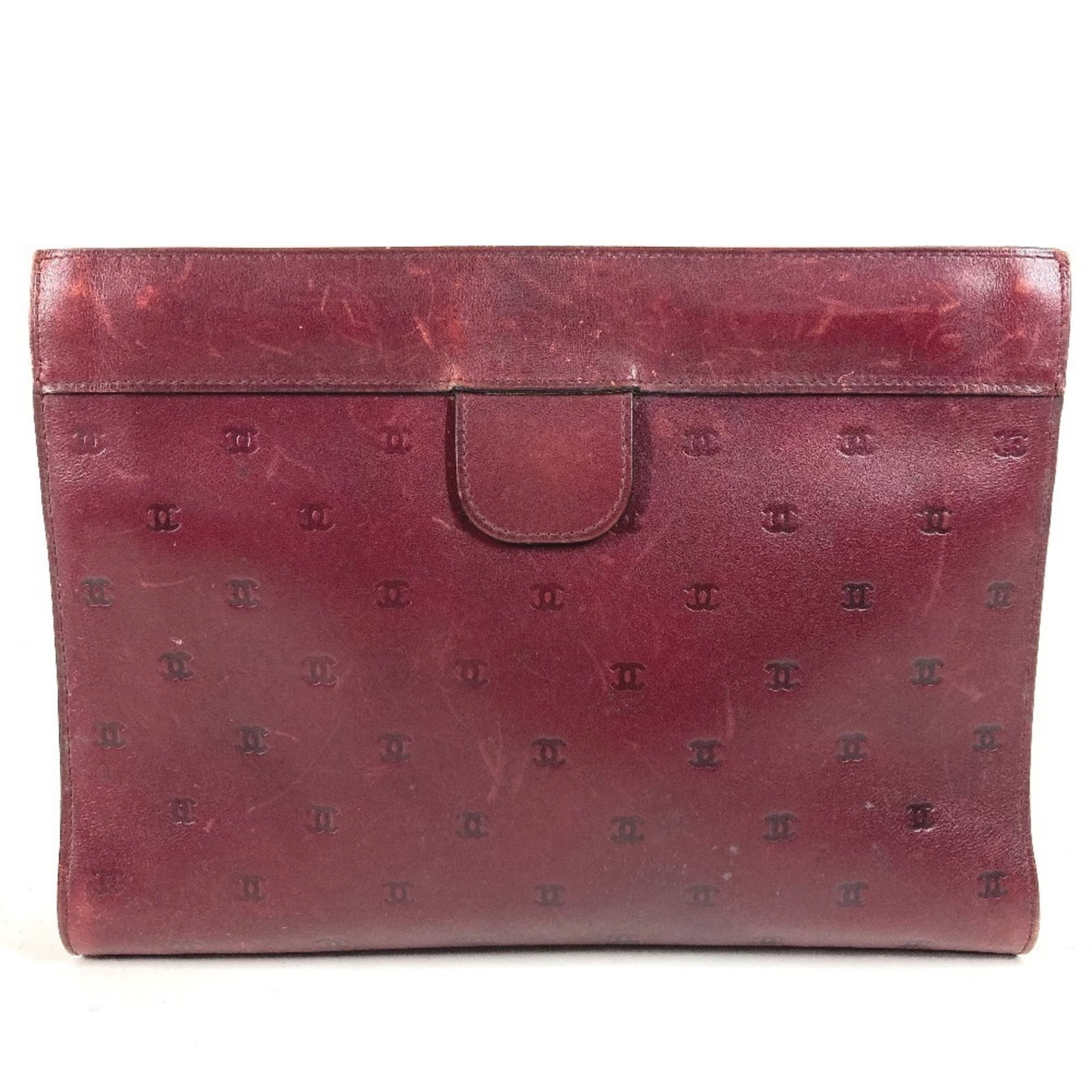 Chanel leather handbag pouch clutch: Chanel leather handbag pouch clutch Chanel's iconic leather handbag pouch clutch, crafted in France, boasts a rich wine color and sleek design. Measuring 17cm x 23cm x 4cm, this compact clutch is