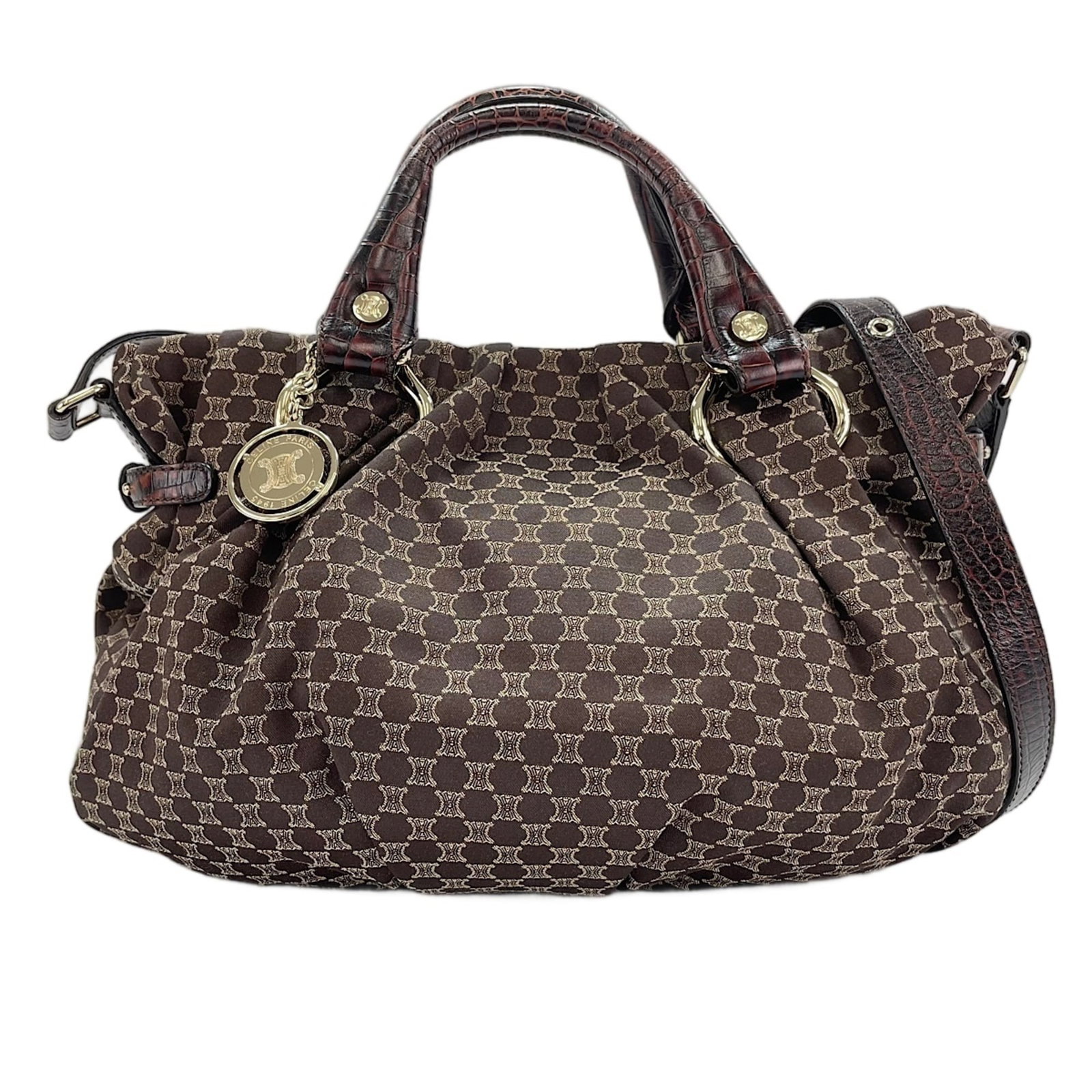 Handbag by Celine: Handbag by Celine Brown Celine Macadam Handbag. This 24cm x 35cm x 15cm handbag features a signature and comes with adjustable straps that can be customized to fit your style, from 88cm to 110cm in le