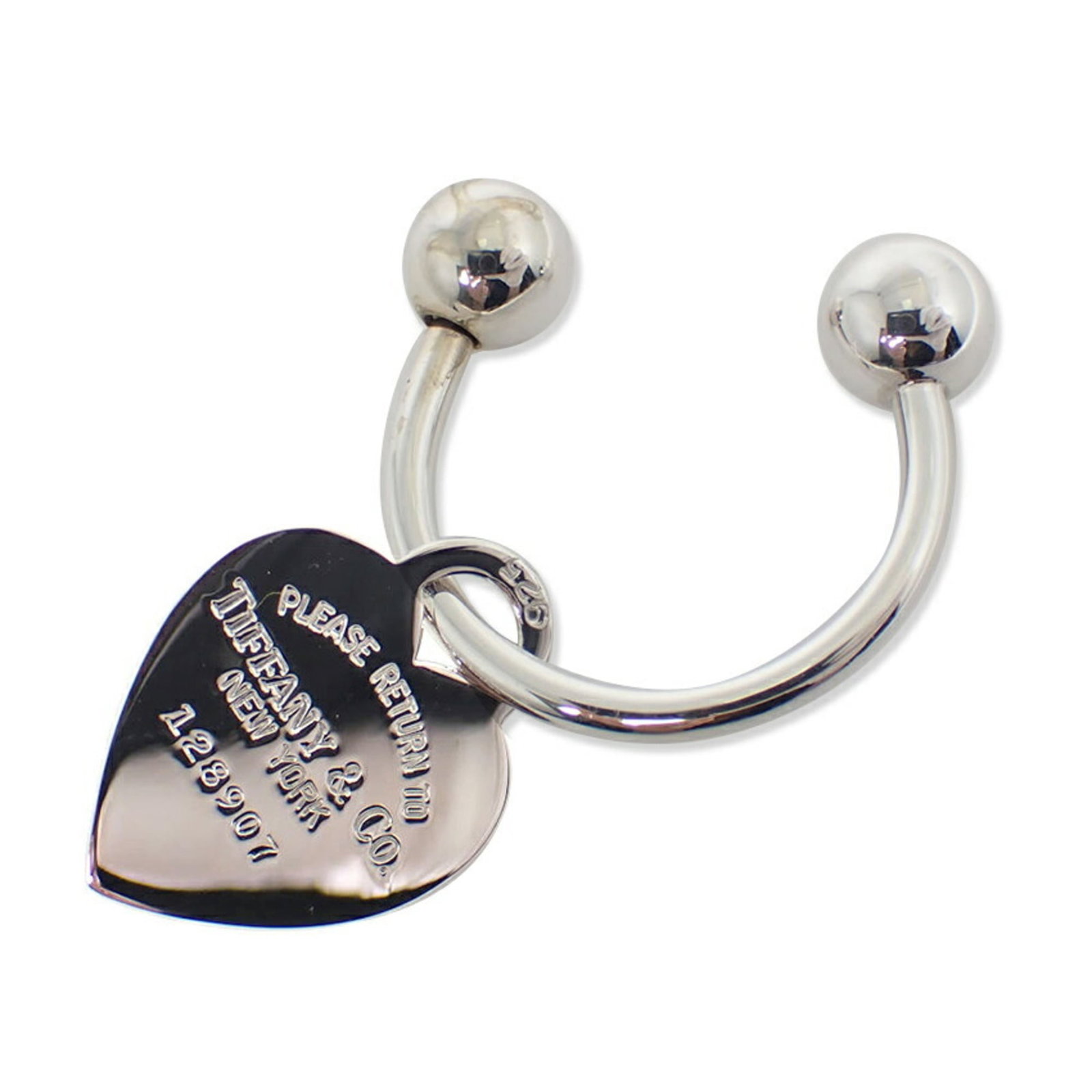 Tiffany Keyring Sterling Silver 925: Tiffany Keyring Sterling Silver 925 Sterling silver 925 keyring from Tiffany, featuring a charm with dimensions of 2.7cm x 2.03cm / 1.06'' x 0.80''. Made from high-quality sterling silver, this elegan