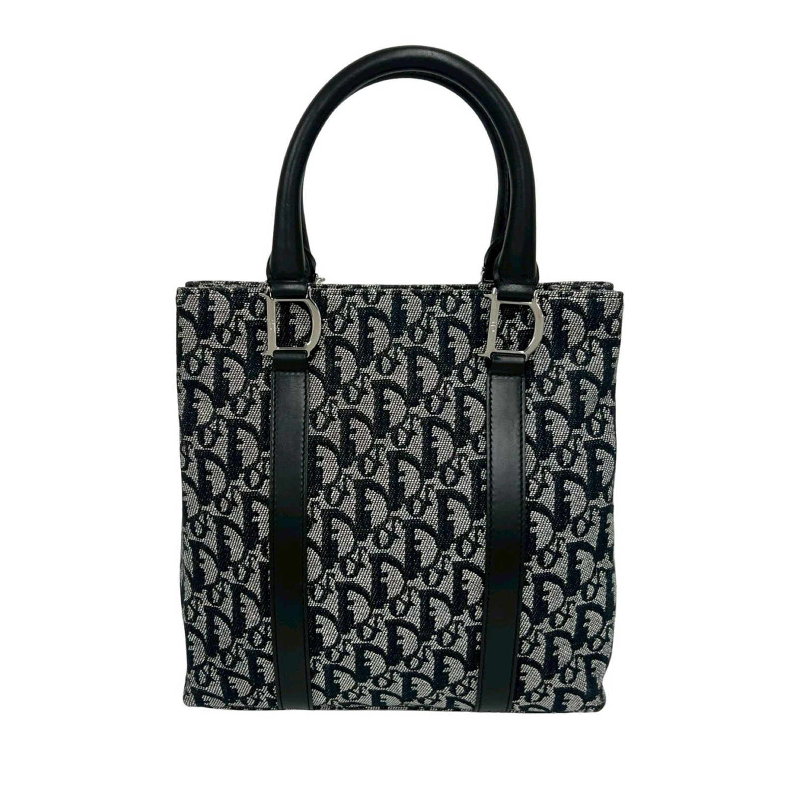 Canvas Leather Handbag Dior Tote Christian: Canvas Leather Handbag Dior Tote Christian Canvas and leather come together in sleek black design, defining the classic look of Christian Dior's Tote bag. With dimensions of 26cm x 25cm x 7.5cm, this