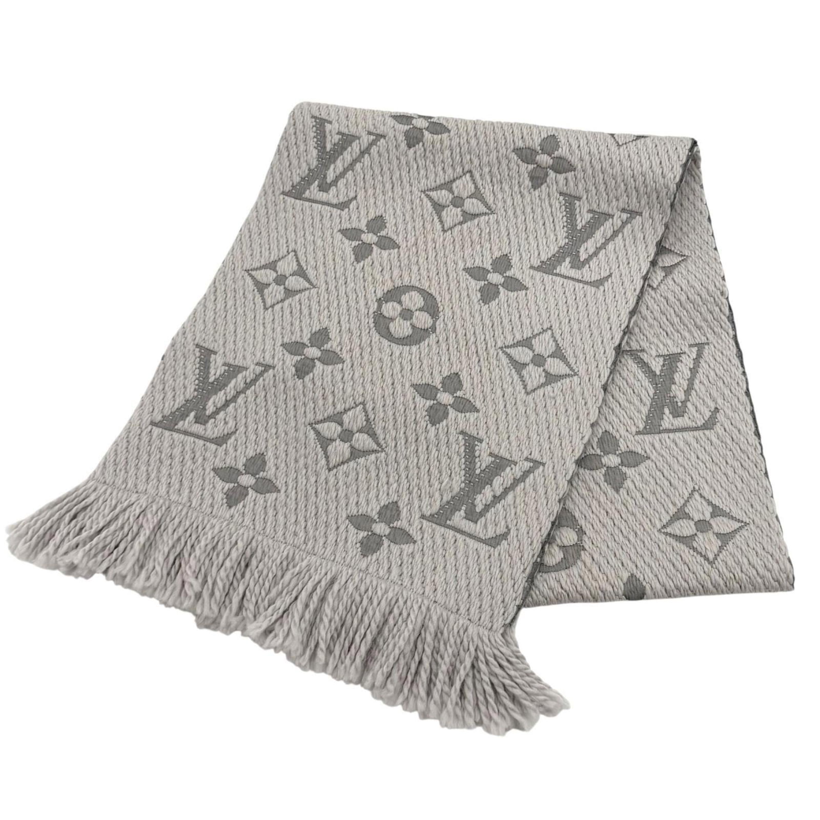 Silk stole by Louis Vuitton: Silk stole by Louis Vuitton Silk stole by Louis Vuitton, featuring a luxurious blend of wool and silk materials in its construction. Measuring 1.57m x 30.5cm, this stole showcases the iconic style and