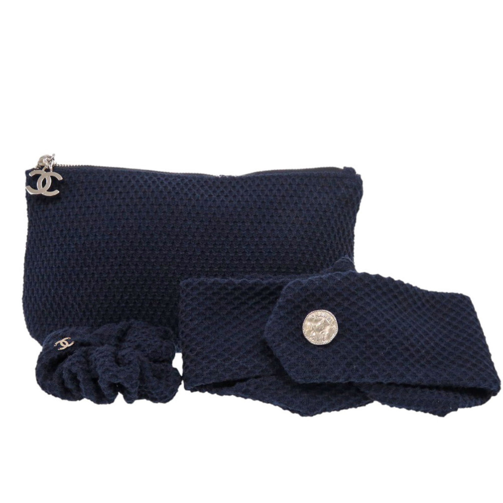Cotton Pouch by Chanel: Cotton Pouch by Chanel Cotton Pouch by Chanel, made from high-quality cotton and featuring a classic navy color with silver hardware, boasts a timeless design. The pouch measures 12.5cm x 22.5cm x