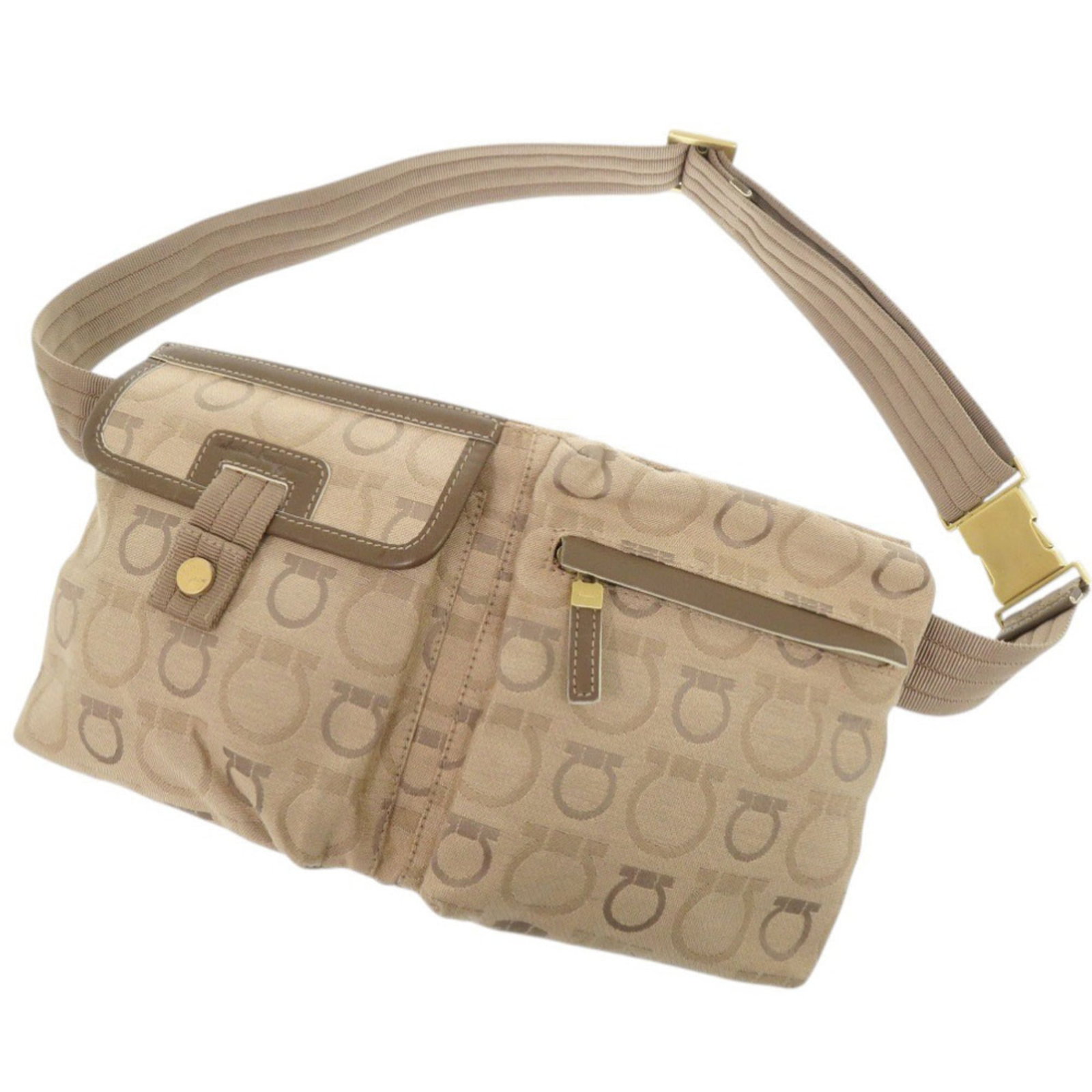 Canvas sling bag from Salvatore Ferragamo: Canvas sling bag from Salvatore Ferragamo The Salvatore Ferragamo Gancini canvas sling bag boasts a timeless design with its beige color and gold hardware. A functional outer pocket with a zipper and