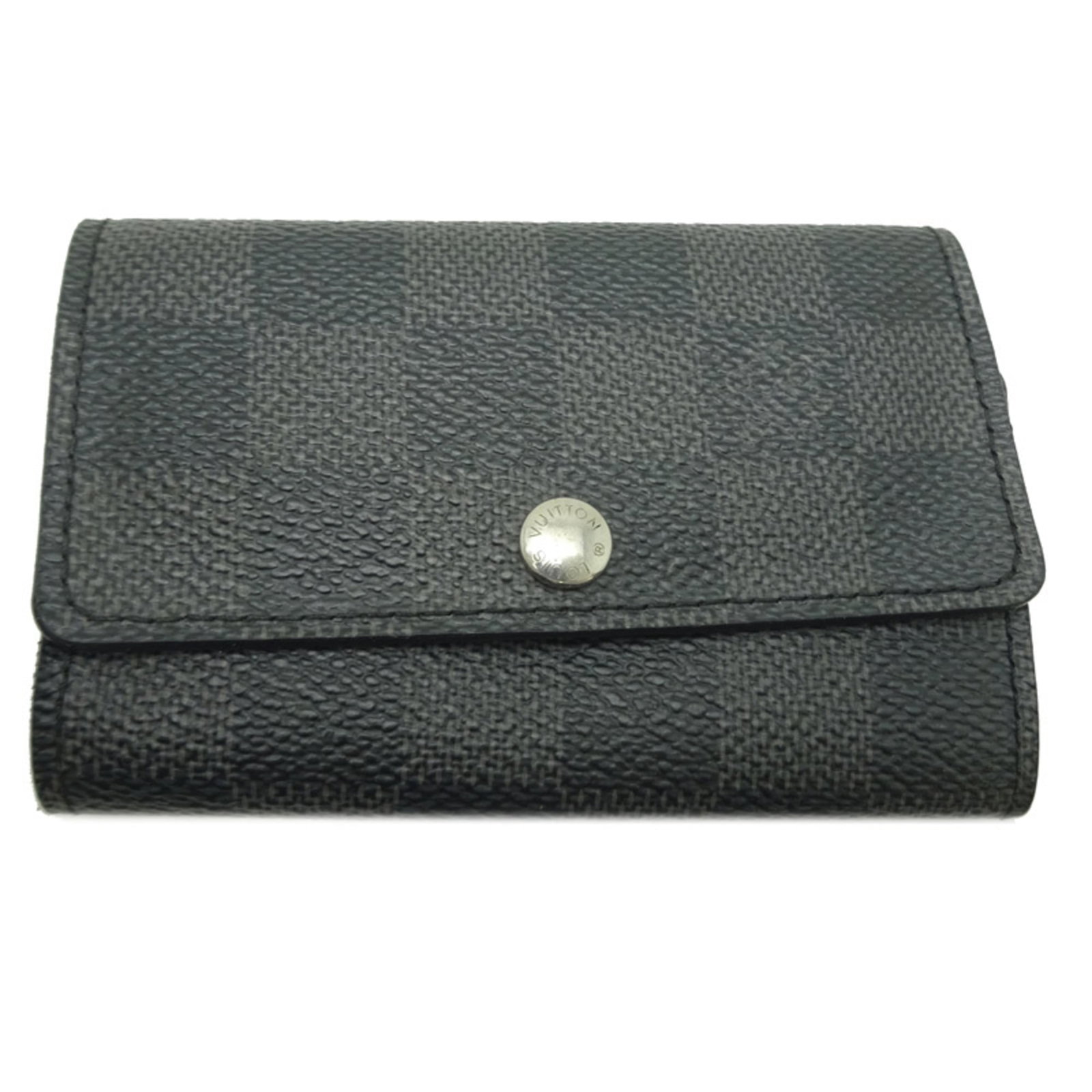 Damier Graphite Keycase by Louis Vuitton: Damier Graphite Keycase by Louis Vuitton Damier Graphite Keycase by Louis Vuitton features a sleek black design with the iconic Damier Graphite pattern, showcasing the signature style of this