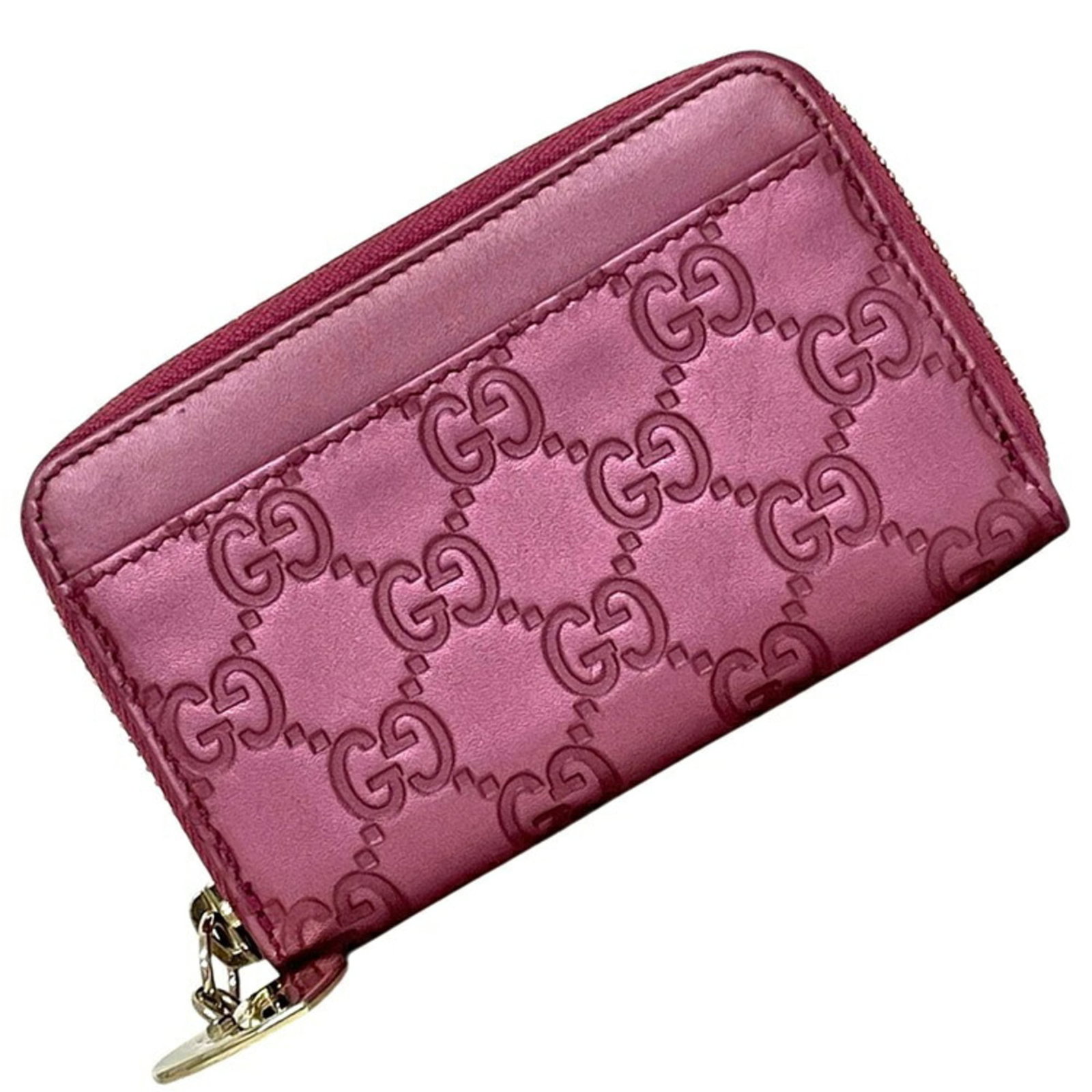 Coin purse leather case: Coin purse leather case This pink leather coin purse case from Gucci measures 8cm x 12cm x 2cm, offering a stylish and compact storage solution. Made from high-quality leather, its sleek design makes