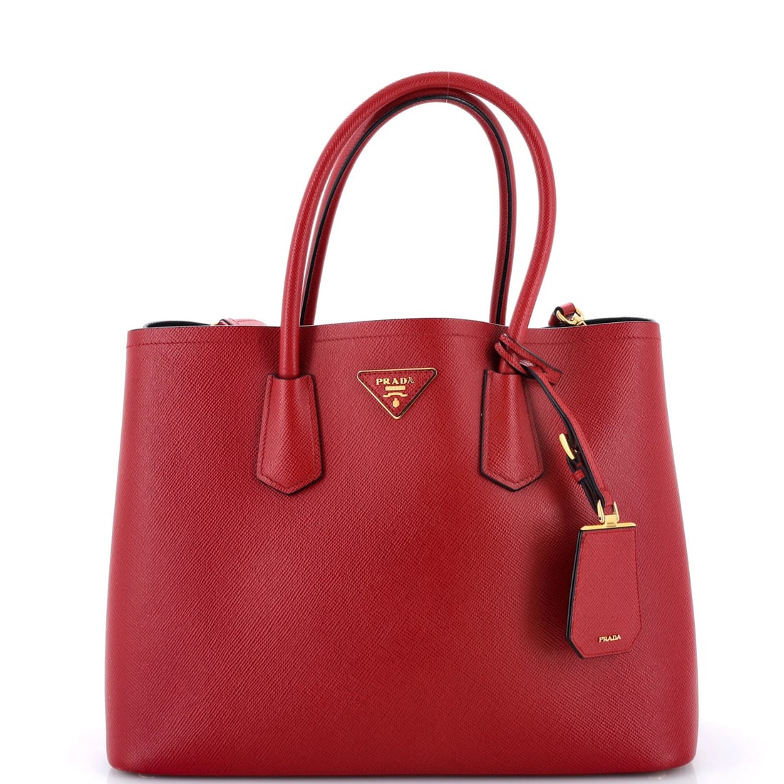 Saffiano Leather Double Cuir Tote Medium: Saffiano Leather Double Cuir Tote Medium Saffiano Leather Double Cuir Tote Medium in vibrant red, featuring a classic design with a poignet luggage tag for added convenience. This medium-sized tote