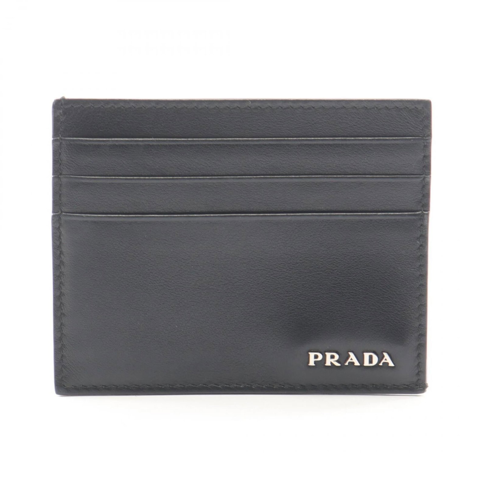 Card case leather by Prada: Card case leather by Prada Black leather card case by Prada, measuring 8cm x 10cm x 5mm. Made from high-quality leather, this compact case features a sleek design that complements any style. The signa