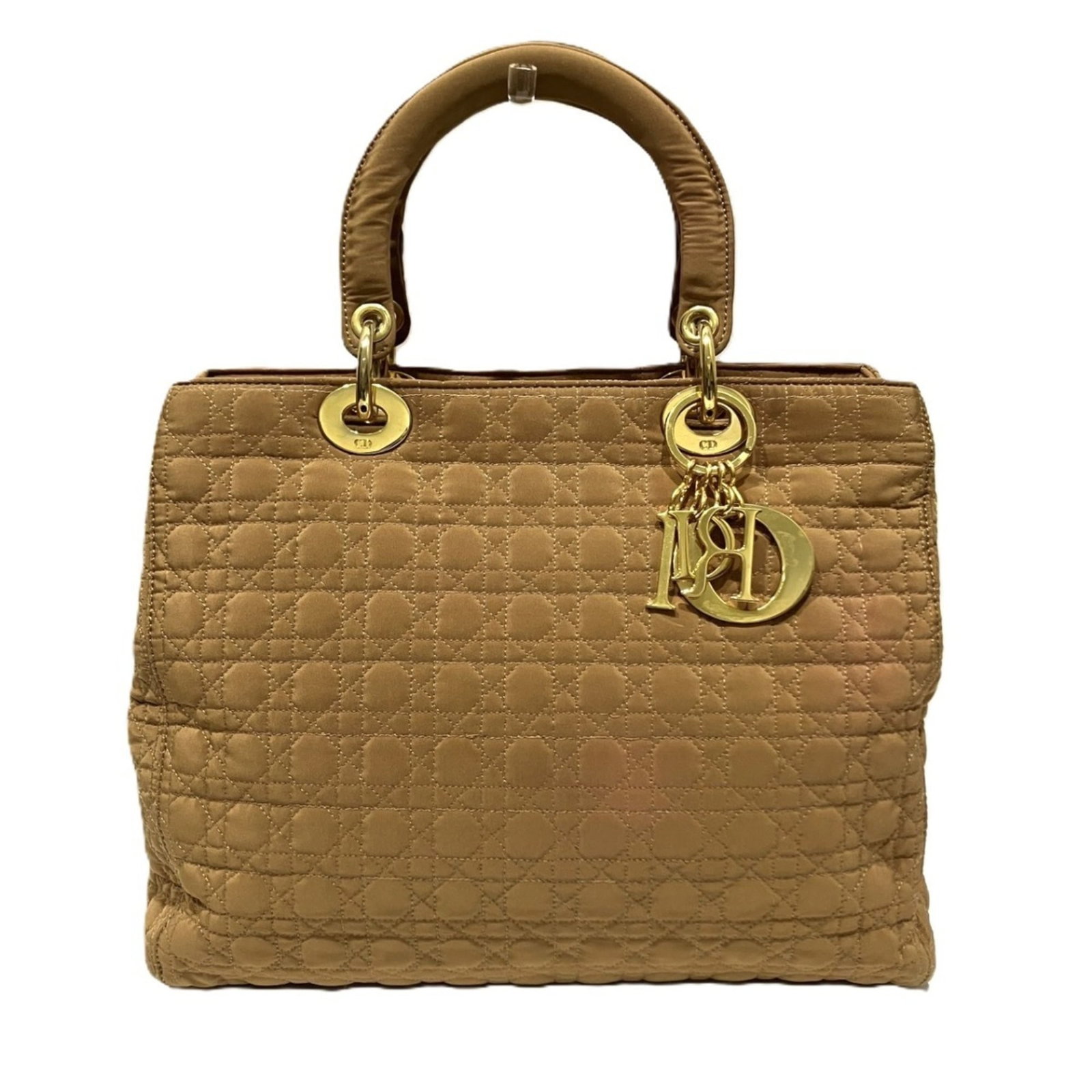 Handbag Nylon from Christian Dior: Handbag Nylon from Christian Dior Christian Dior Handbag Nylon. Made from high-quality nylon, this handbag boasts a classic design with clean lines and a timeless appeal. With its signature brown colo