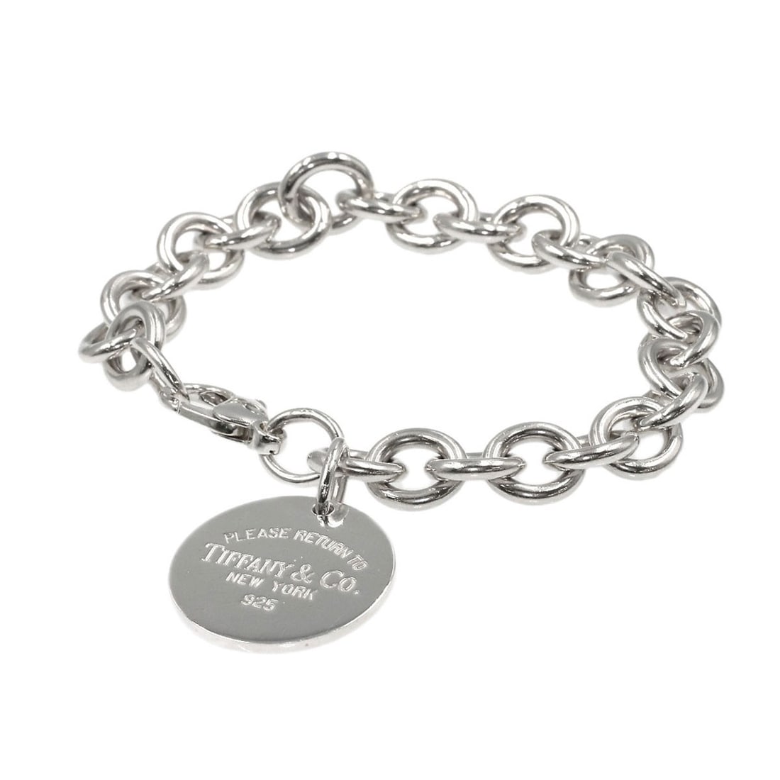 Return to Tiffany Round Silver Bracelet: Return to Tiffany Round Silver Bracelet Round silver Tiffany&Co. bracelet with a sleek, modern design and a sophisticated silver finish. This elegant piece features no stone, adding to its