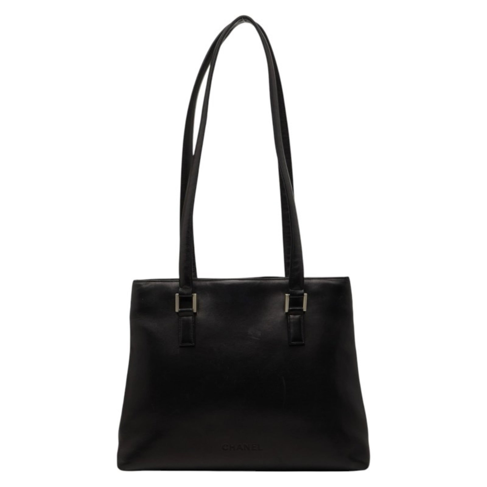Shoulder Bag Leather Tote Chanel: Shoulder Bag Leather Tote Chanel This luxurious leather tote bag from Chanel features rich lambskin material and sleek black design, measuring 26cm x 35cm x 9cm. The classic shoulder strap adds a touc