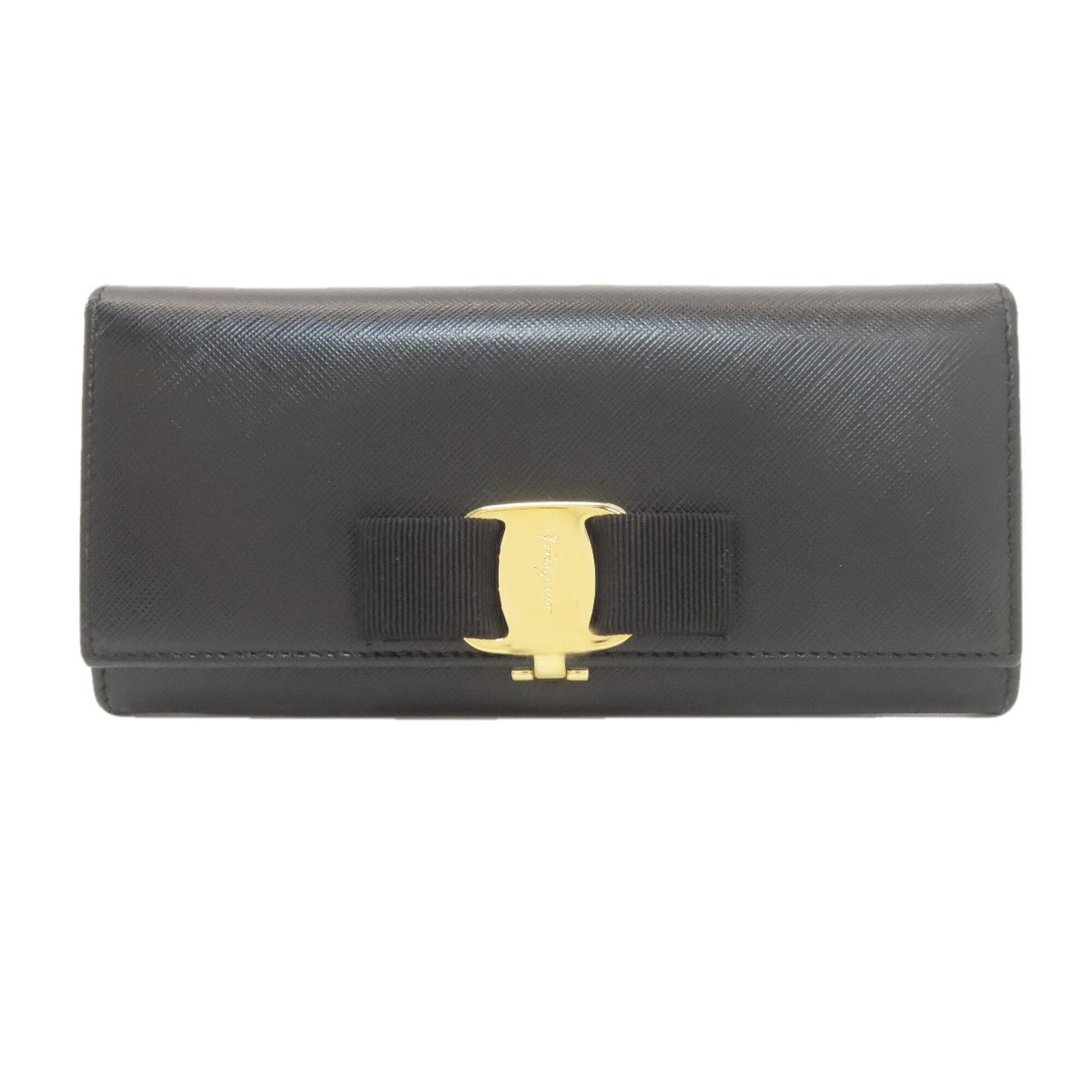 Long Wallet Ferragamo Salvatore Bi Fold Leather: Long Wallet Ferragamo Salvatore Bi Fold Leather Black leather bi-fold wallet from Salvatore Ferragamo, featuring a sleek design with clean lines and classic style. Measuring 10cm x 18cm x 2.5cm, it