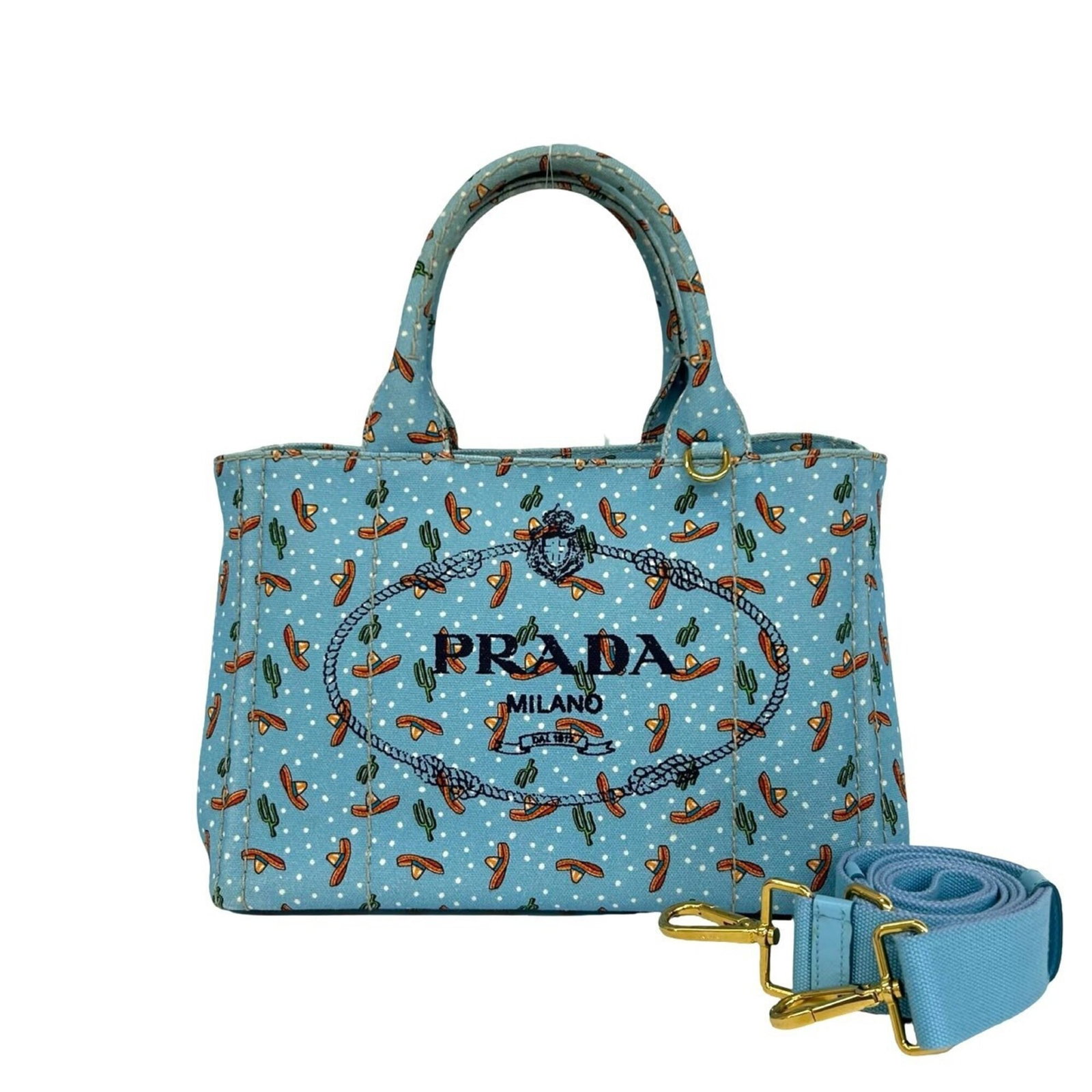 Handbag shoulder bag tote bag canvas: Handbag shoulder bag tote bag canvas Canvas Prada shoulder bag tote in blue. This canvas handbag measures 19.5cm x 27.5cm x 14.5cm and features a sturdy design with a signature on the work (note: deta