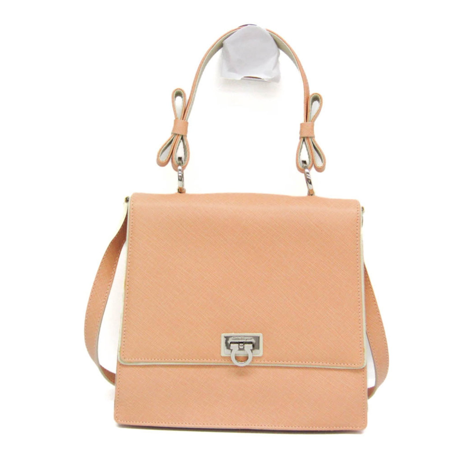 Handbag Salvatore Ferragamo Leather Shoulder: Handbag Salvatore Ferragamo Leather Shoulder The Salvatore Ferragamo Leather Shoulder bag boasts a striking pale orange hue, adorned with metal fasteners and a ribbon handle. With an inner zipper pock