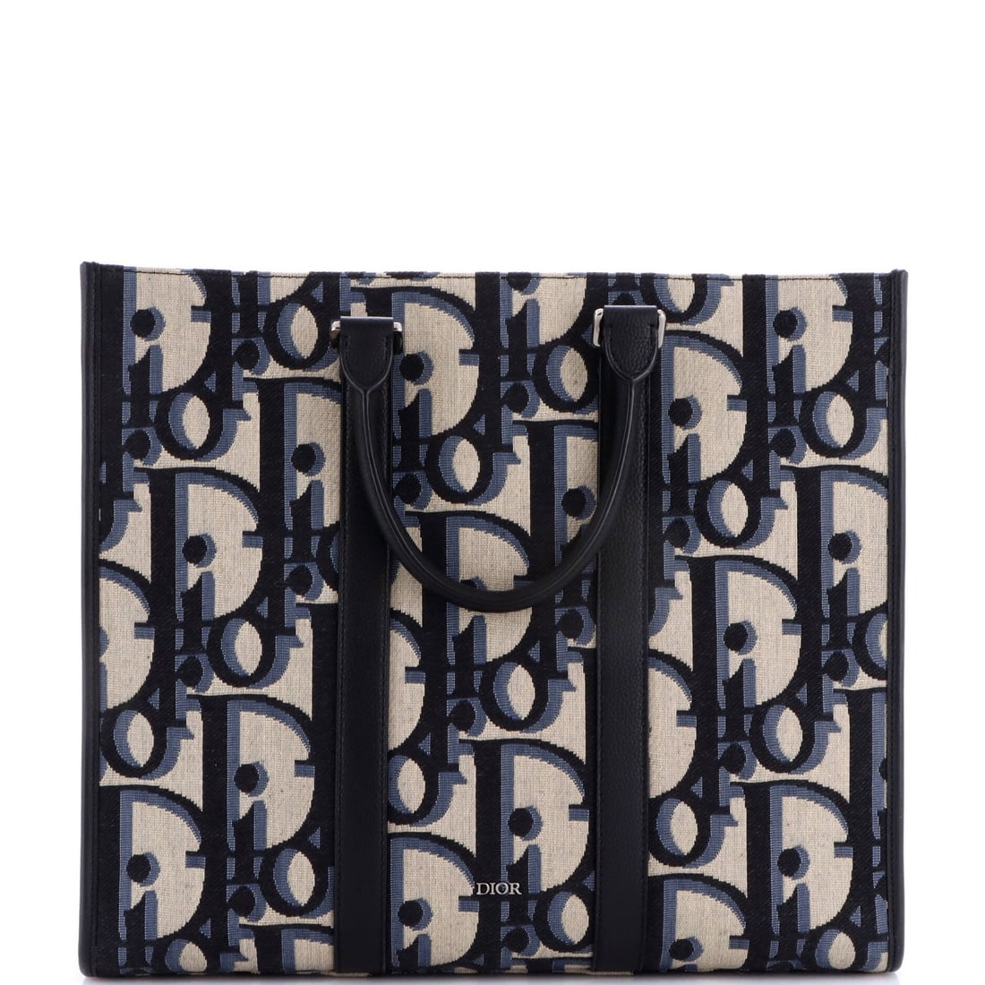 Dior Convertible Canvas Oblique Maxi East West Tote: Dior Convertible Canvas Oblique Maxi East West Tote The Dior Convertible Canvas Oblique Maxi East West Tote boasts a striking blue canvas exterior with minor creases and scuffs, giving it a worn-in