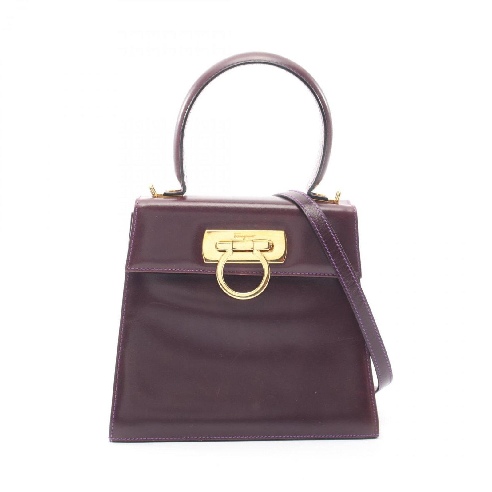 Salvatore Ferragamo Handbag Leather: Salvatore Ferragamo Handbag Leather The Salvatore Ferragamo handbag features rich, luxurious leather in a deep purple hue. Measuring 18cm x 20cm x 8cm, it boasts a sleek design with clean lines and a