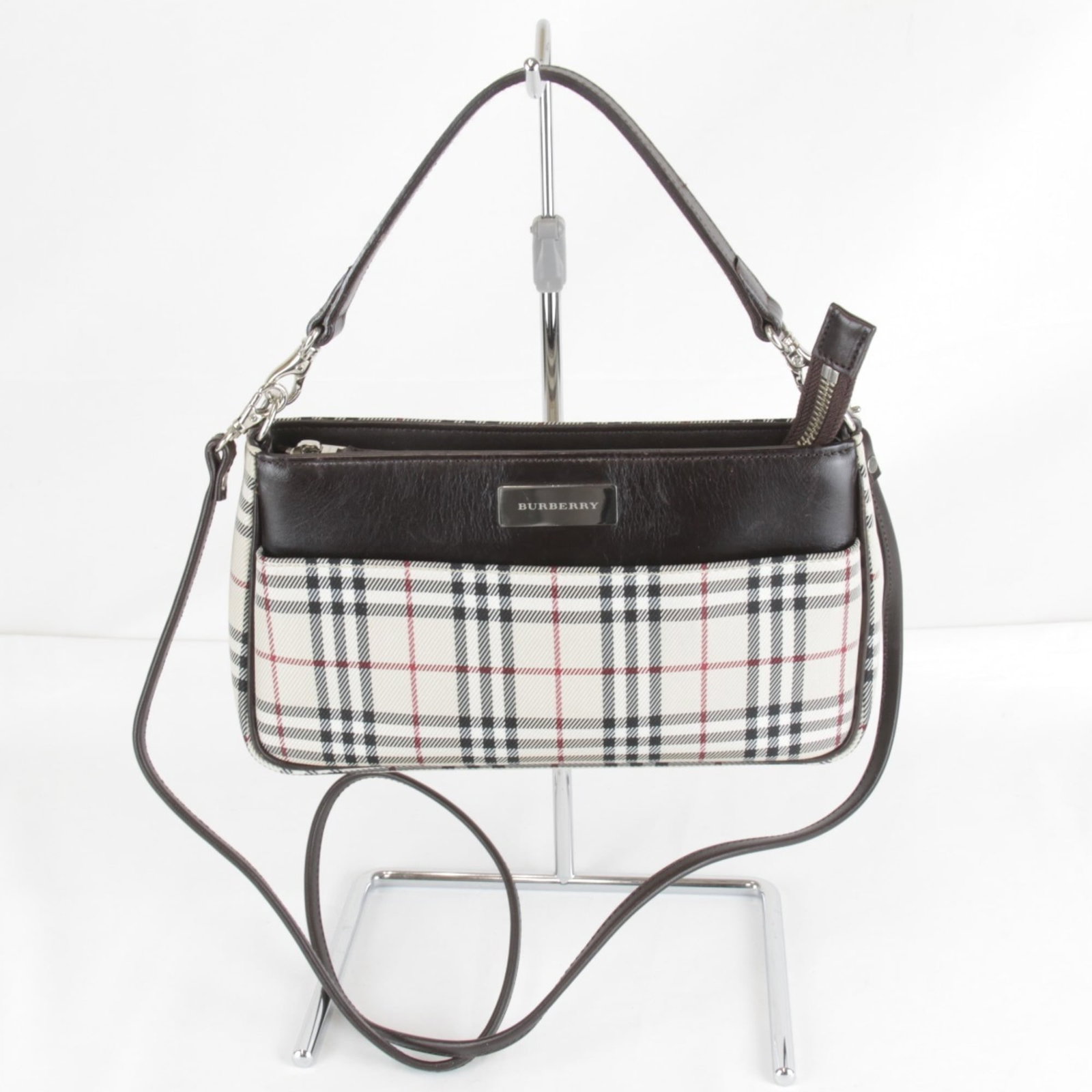 Canvas Shoulder Bag Burberry: Canvas Shoulder Bag Burberry Canvas shoulder bag in beige from Burberry, featuring a classic design with clean lines and a spacious interior. The bag measures 12cm x 22cm x 5cm and has a sturdy