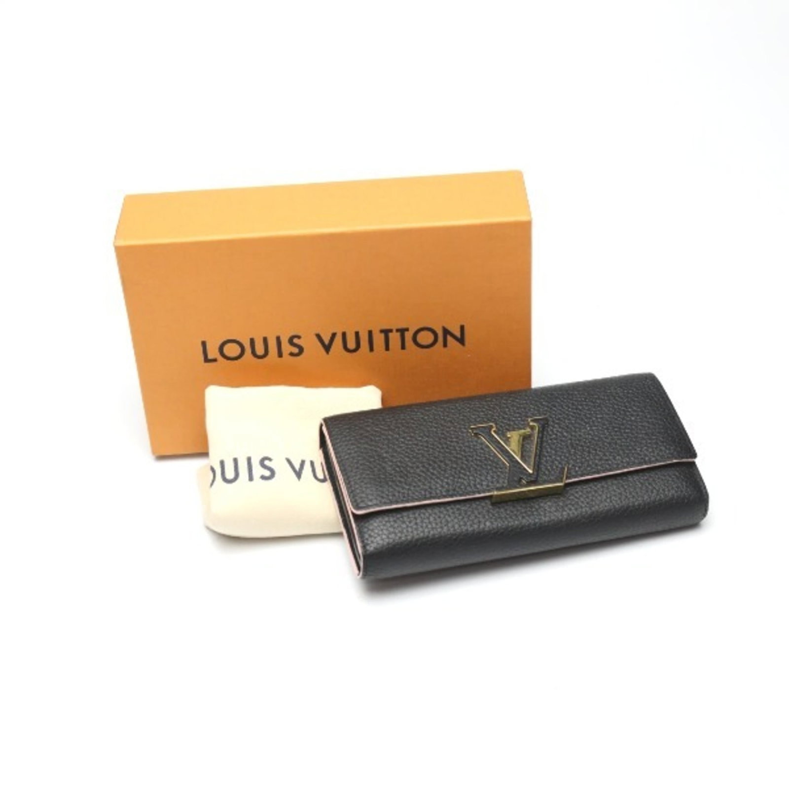 Long Wallet Bi Fold Leather Louis Vuitton: Long Wallet Bi Fold Leather Louis Vuitton Taurillon leather gives this bi-fold long wallet its distinctive look and feel. The black color provides a sleek, timeless appearance that pairs well with a