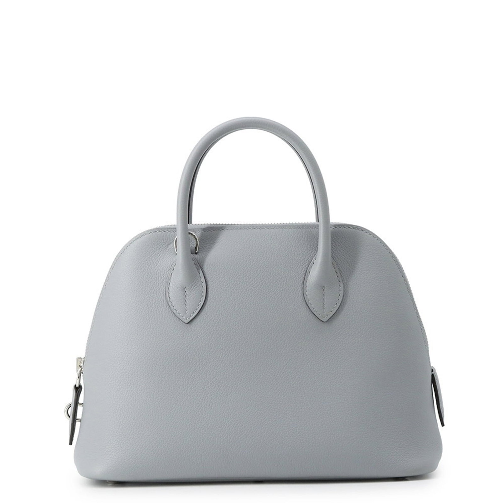 Handbag by Hermes: Handbag by Hermes Silver hardware and zipper closure define the sleek lines of this Bolide handbag from Hermes, crafted in France with attention to detail. Weighing in at 570g, its compact size belies