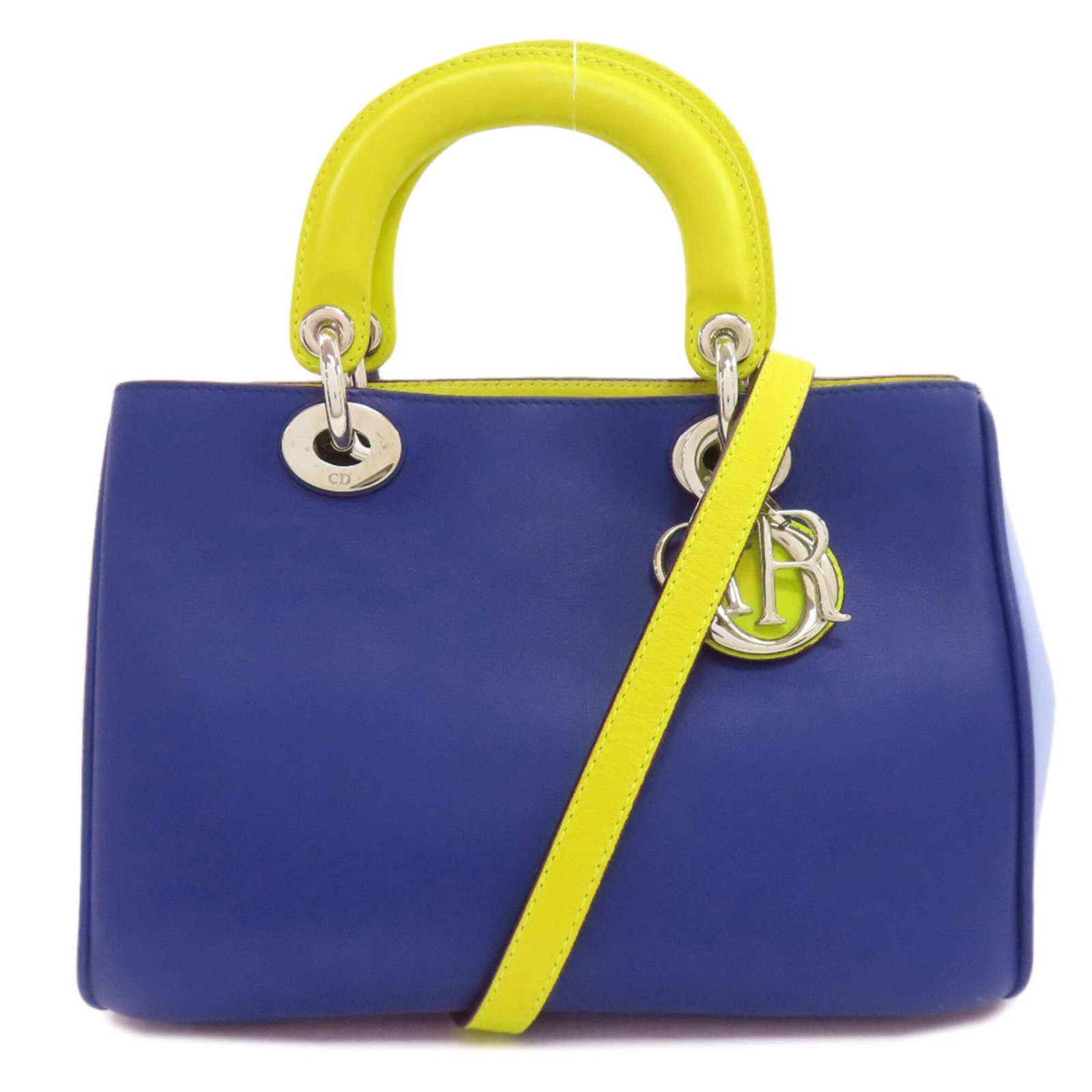 Handbag Christian Dior Leather: Handbag Christian Dior Leather This Christian Dior leather handbag boasts a striking blue and green color combination, perfectly balanced by its sleek calfskin material. The classic design features a