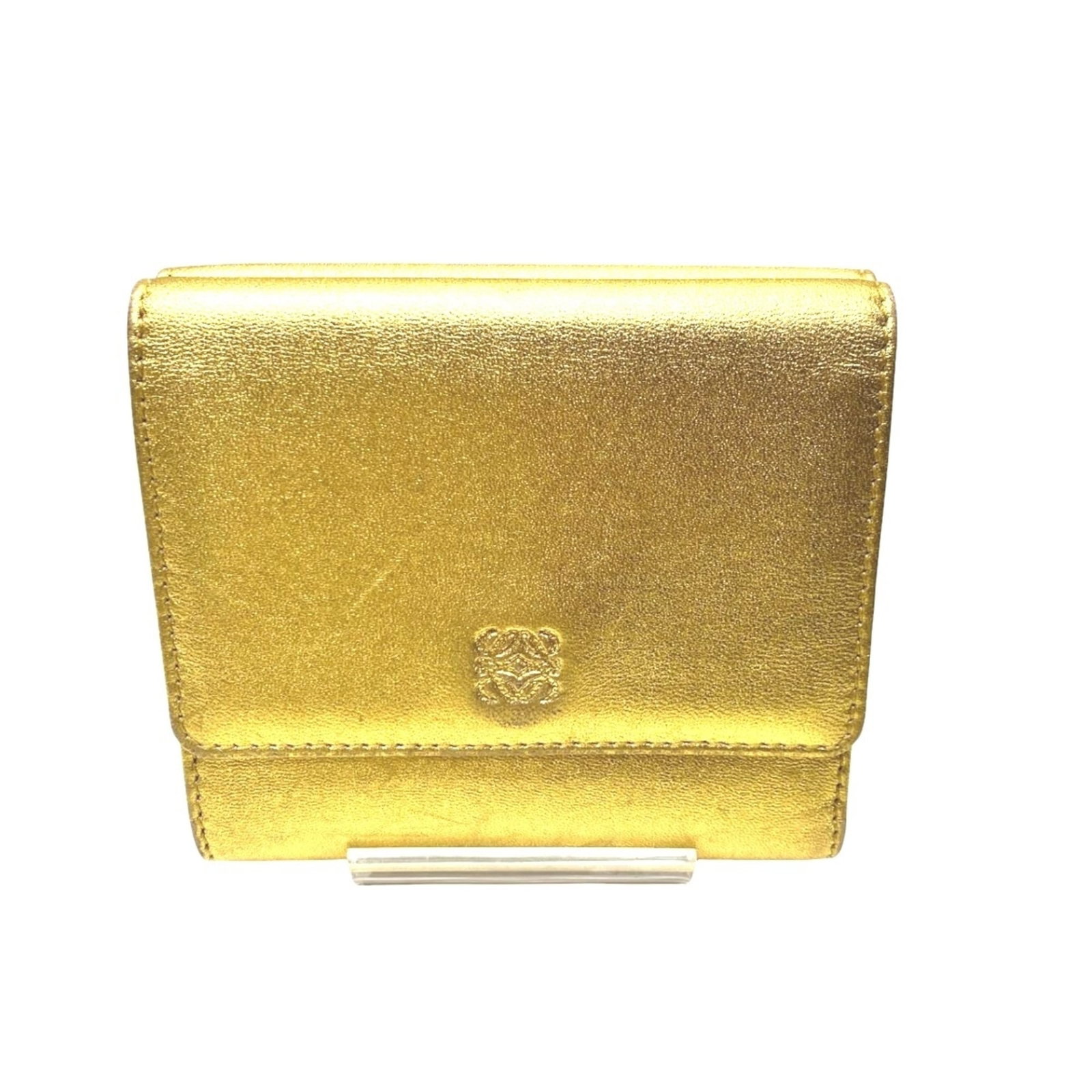 Loewe Wallet (Tri-Fold) Leather: Loewe Wallet (Tri-Fold) Leather 9.5cm x 10.5cm x 2.5cm tri-fold leather wallet from renowned brand Loewe, featuring a gold finish and classic design. This stylish accessory boasts a premium leather